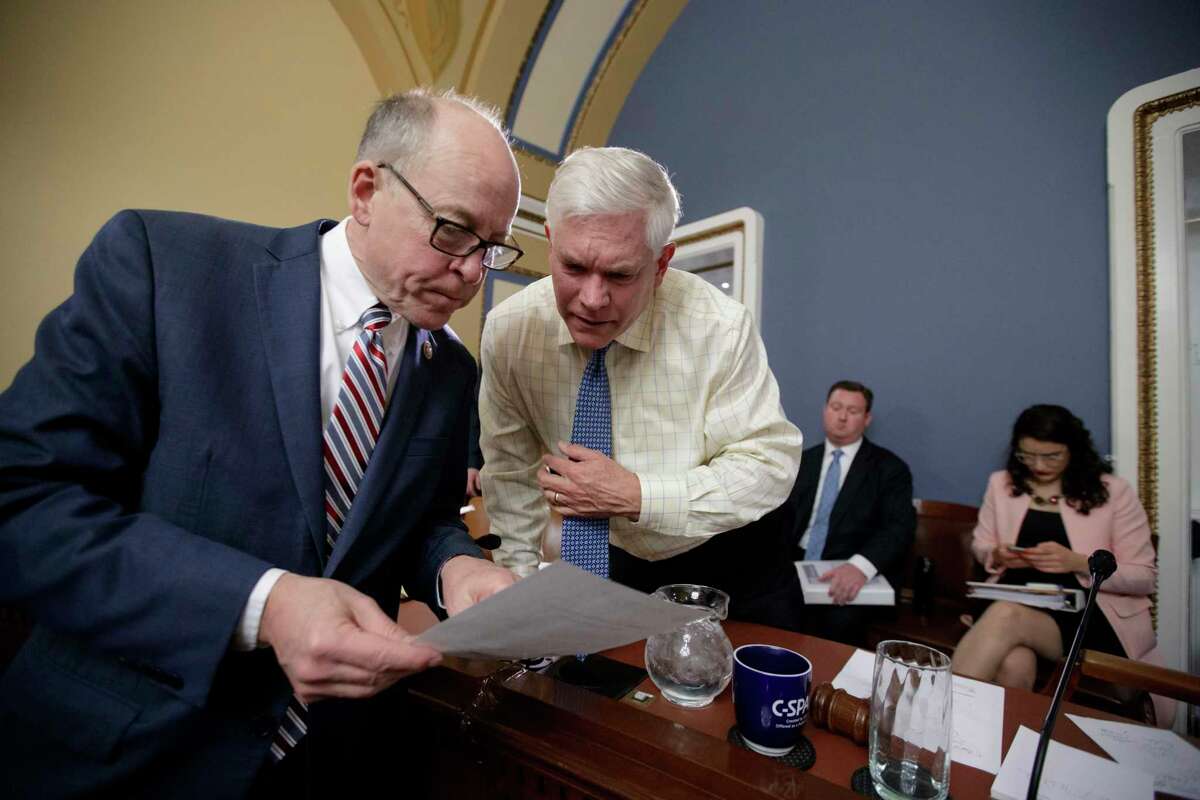 House Energy and Commerce Committee Chairman Rep. Greg Walden, R-Ore., left, confers with House Rules Committee Chairman Rep. Pete Sessions, R-Texas on Capitol Hill in Washington, Wednesday, March 22, 2017, during a meeting to shape the final version of the Republican health care bill before it goes to the floor for debate and a vote. (AP Photo/J. Scott Applewhite)