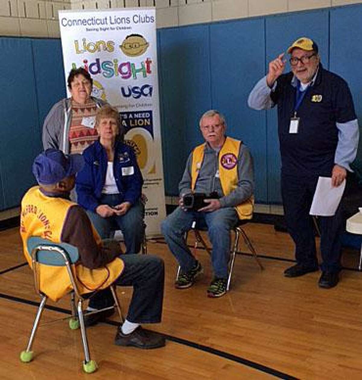 The New Milford Lions Club recently provided no-cost computerized screening of vision for 500 children through second grade in the New Milford school system. Above are, from left to right, Lions Herman Izzard and Josephine Barrett, Lion Phyllis Sandshaw of the Torrington Lions Club and Lions John Dunne and Bob Coppola.