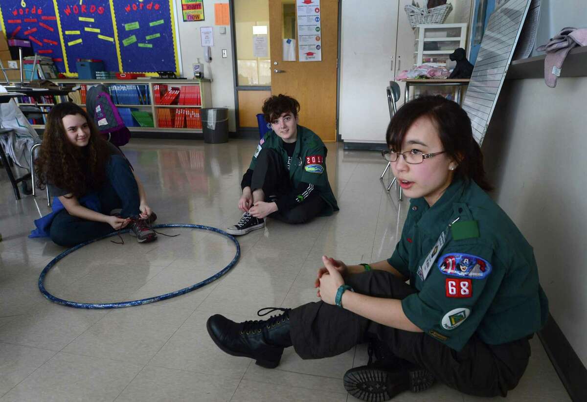 Girl Scout Kate Sun of Redding gives a lesson to fellow scouts, Cat Slanski and Bianca Byrne, on Edge Leadership Skills.