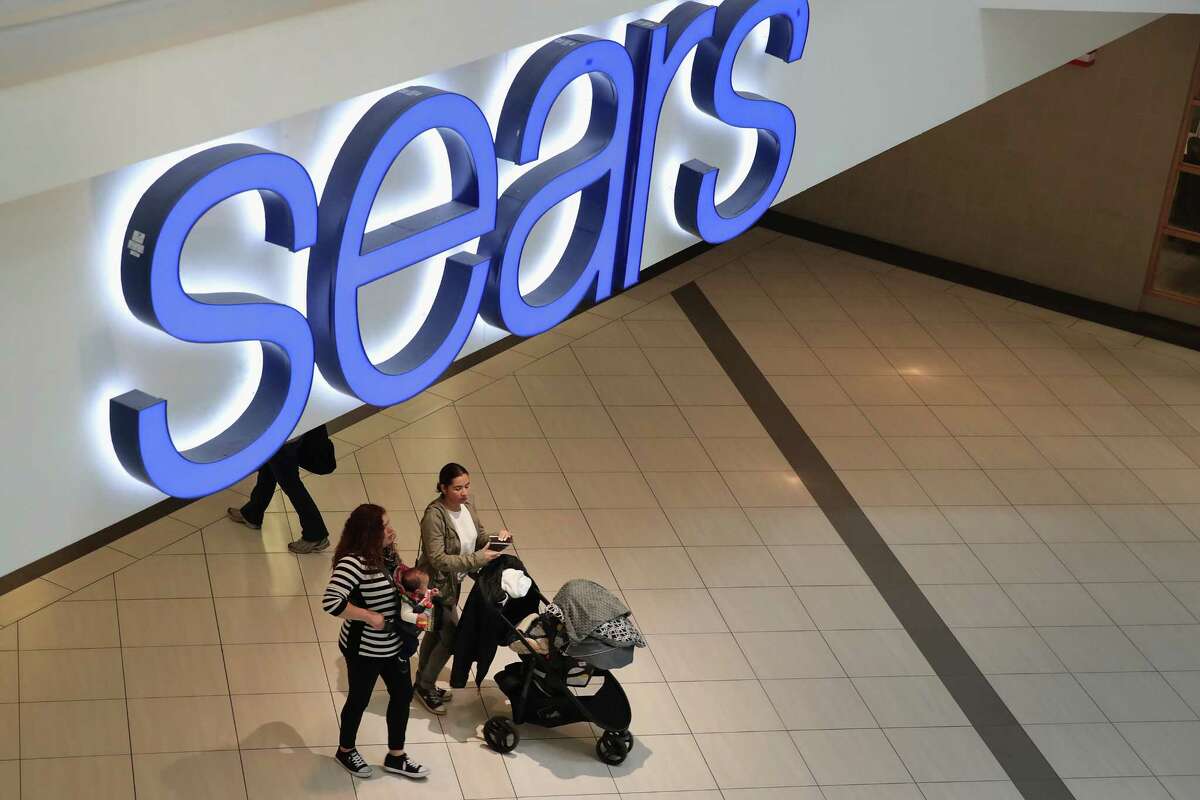 Shoppers visit a Sears store on Wednesday in the Chicago suburb of Schaumburg. For decades, Sears was king of the American shopping landscape.