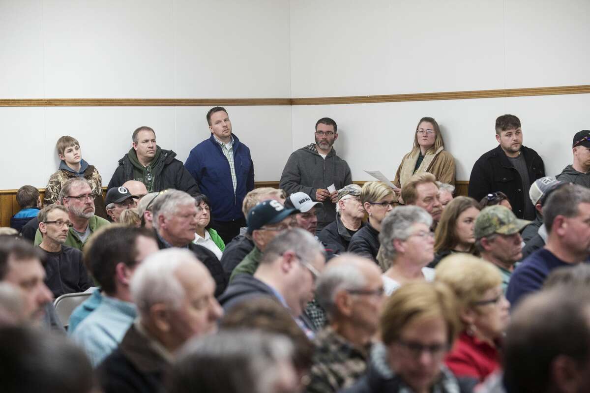 The crowd listens to Scotty Kehoe, DTE Energy regional manager for corporate and government affairs, on Wednesday at Ingersoll Twp. Hall. The Ingersoll Twp. Board held a special town hall meeting to discuss the possibility of wind turbines in the township. After hearing from Kehoe, attendees had a chance to make comments before the board voted on a year-long moratorium.