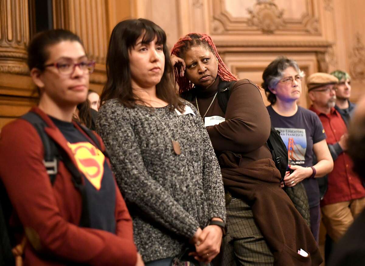 Rosa Parks Elementary School teacher Sekani Moyenda, center, waits to address the San Francisco Board of Supervisors during a hearing on affordable teacher housing on Wednesday, March 22, 2017, in San Francisco.
