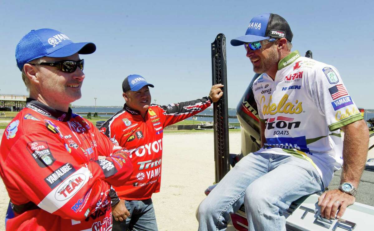 Jeff Kriet (right) jokes with fellow pro pro bass anglers Mark Menendez and Terry Schroggins at Lake Conroe on March 21, 2017. The three will be among the 52 competitors in the Bassmaster Classic on Friday through Sunday.