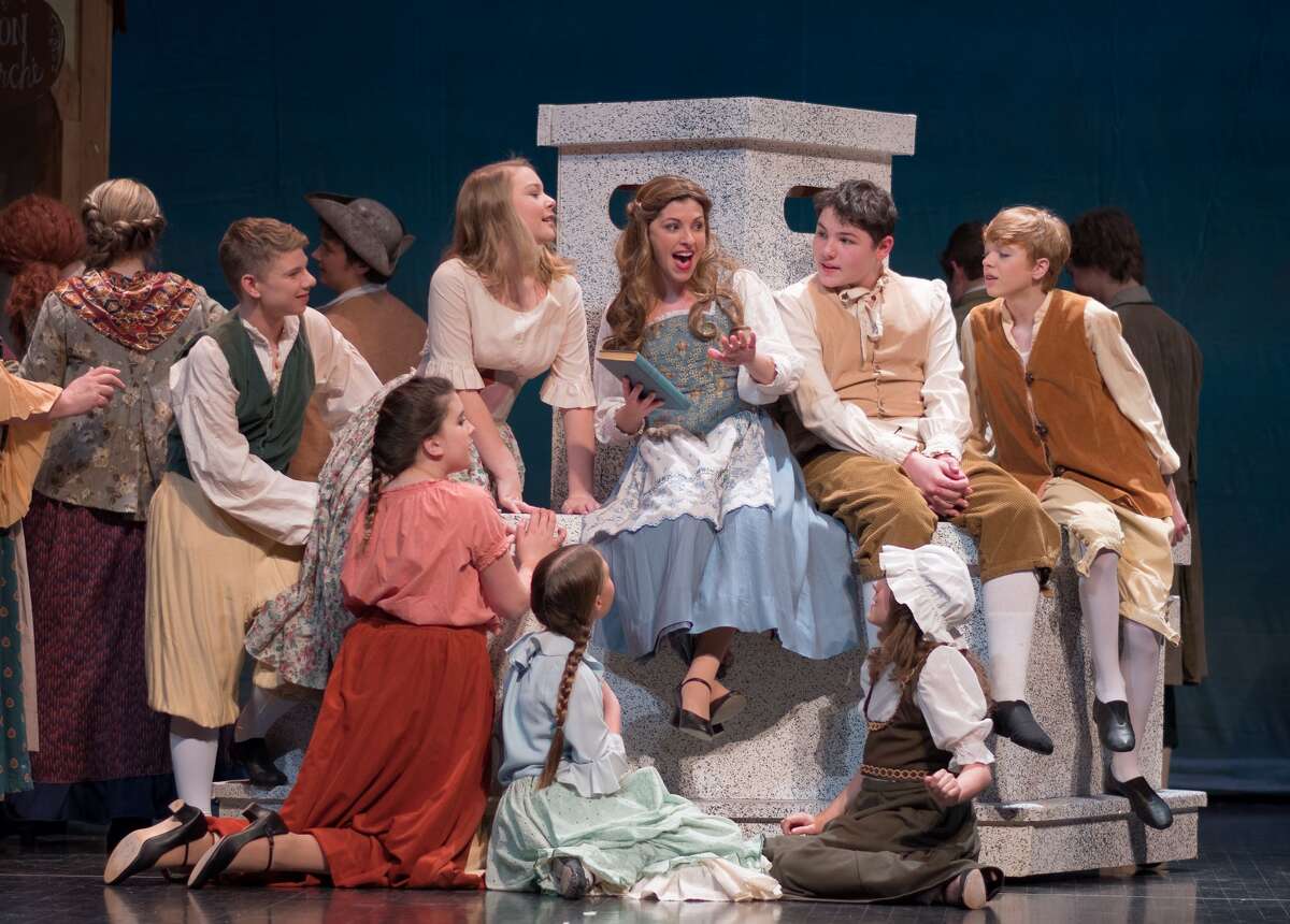 STEVEN SIMPKINS | for the Daily News Tara Besso Ell, center, and the cast from the Midland Center for the Arts Center Stage Theatre production of "Beauty and the Beast" rehearse a scene Wednesday evening. The musical opens March 25 at 7:30 p.m. and has five more shows running March 26 at 3 p.m., March 30-April 1 at 7:30 p.m., April 2 at 3:00 p.m.