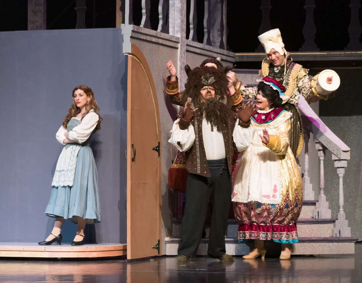 STEVEN SIMPKINS | for the Daily News From left: Tara Besso Ell, True Rogers, Sarah Smith and Stephen Fort rehearse a scene from the Center Stage Theatre's production of "Beauty and the Beast" Wednesday evening at the Midland Center for the Arts. The musical opens March 25 at 7:30 p.m. and has five more shows running March 26 at 3 p.m., March 30-April 1 at 7:30 p.m., April 2 at 3:00 p.m.
