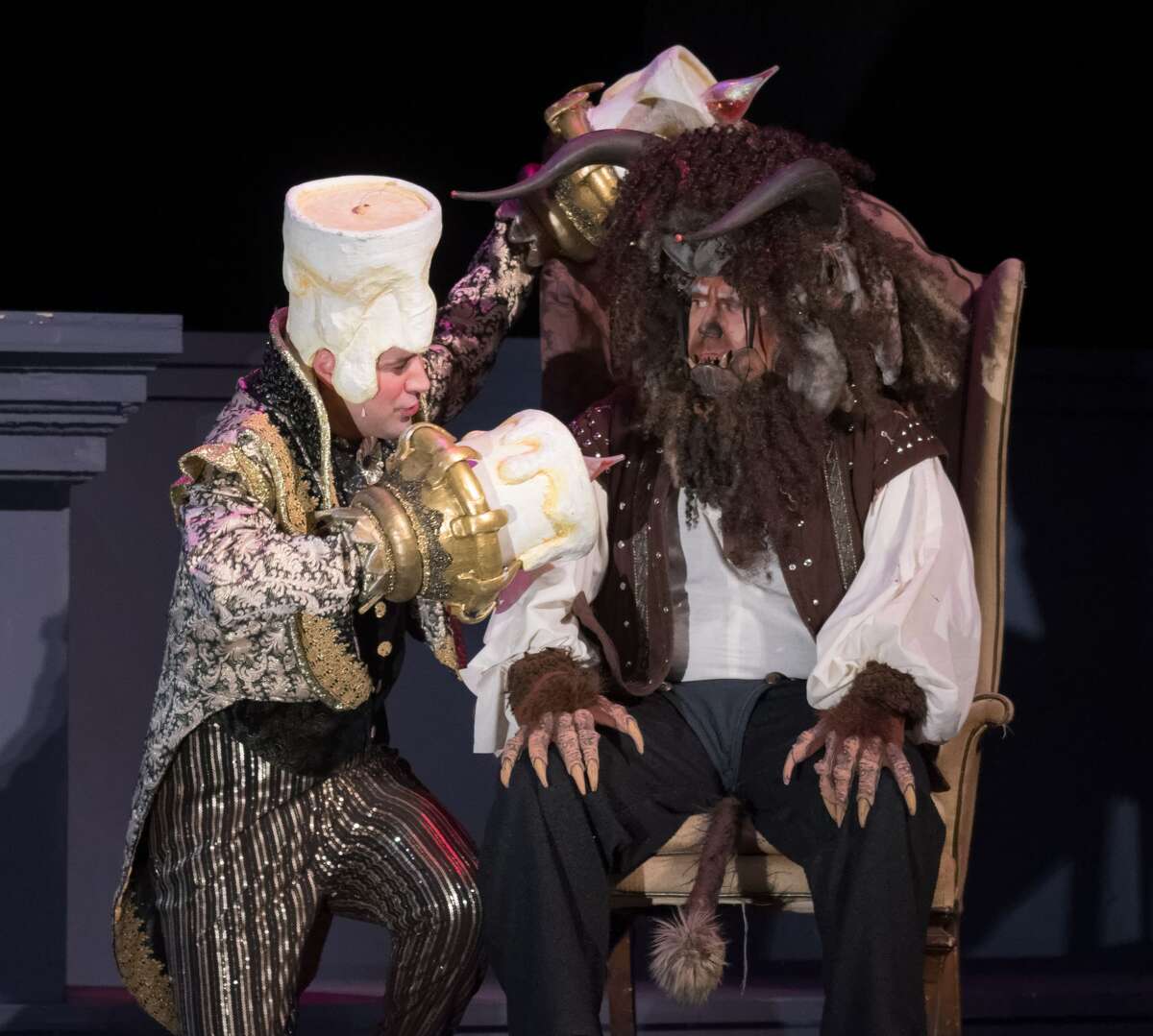 STEVEN SIMPKINS | for the Daily News Stephen Fort, left, and True Rogers rehearse a scene from the Center Stage Theatre's production of "Beauty and the Beast" Wednesday evening at the Midland Center for the Arts. The musical opens March 25 at 7:30 p.m. and has five more shows running March 26 at 3 p.m., March 30-April 1 at 7:30 p.m., April 2 at 3:00 p.m.