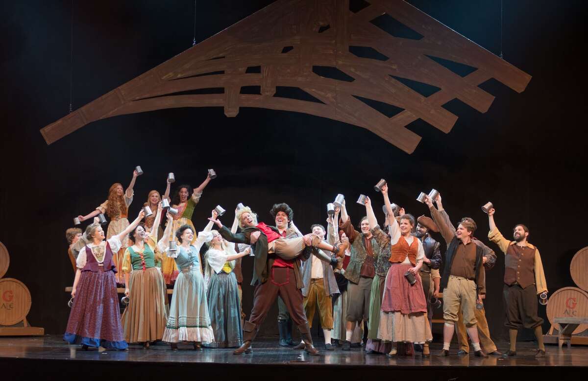 STEVEN SIMPKINS | for the Daily News Phillip James Horen, left, and Patrick Schefsky and members of the cast rehearse a scene from the Center Stage Theatre's production of "Beauty and the Beast" Wednesday evening at the Midland Center for the Arts. The musical opens March 25 at 7:30 p.m. and has five more shows running March 26 at 3 p.m., March 30-April 1 at 7:30 p.m., April 2 at 3:00 p.m.
