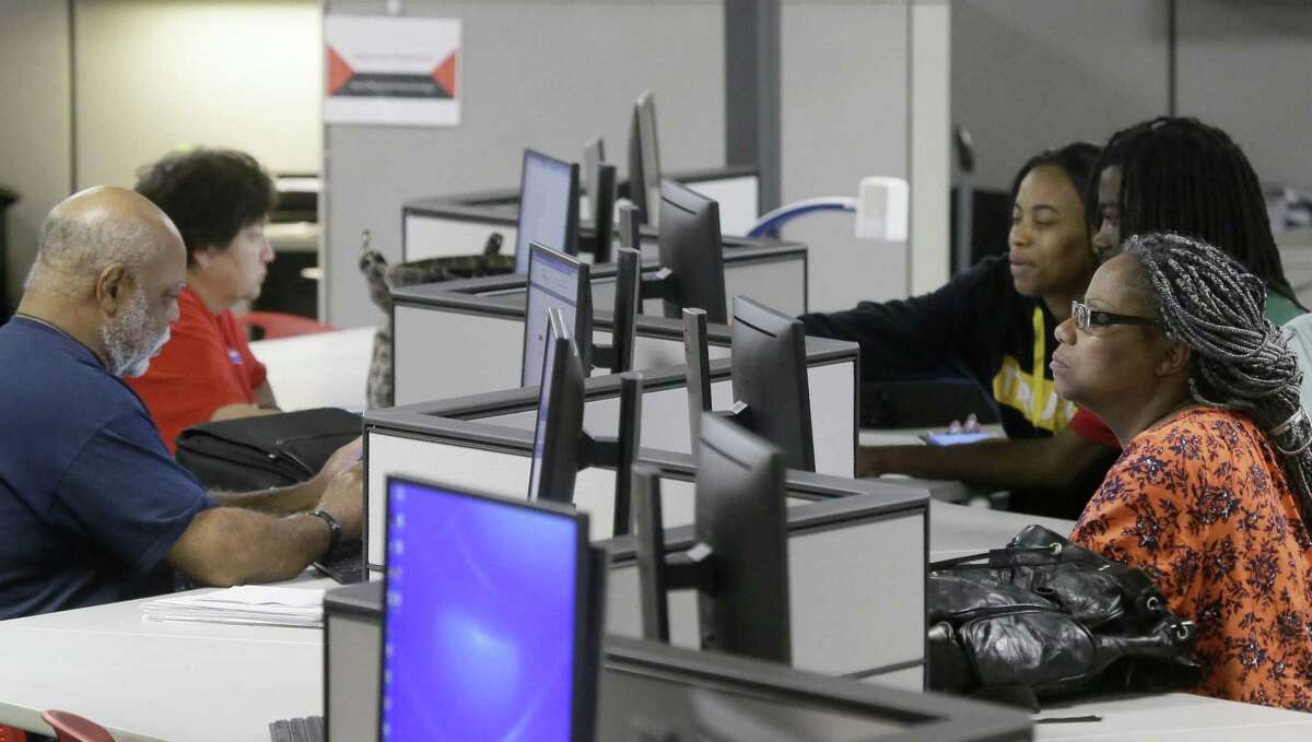 Job seekers use computers to search for a job at the Texas Workforce Solutions office in Dallas. Weekly unemployment benefit applications rose 15,000 last week to a seasonally adjusted 258,000, the Labor Department said Thursday. Applications have been below 300,000, a historically low level, for 80 weeks. The figure had topped 100 weeks, but the Labor Department revised the data Thursday.