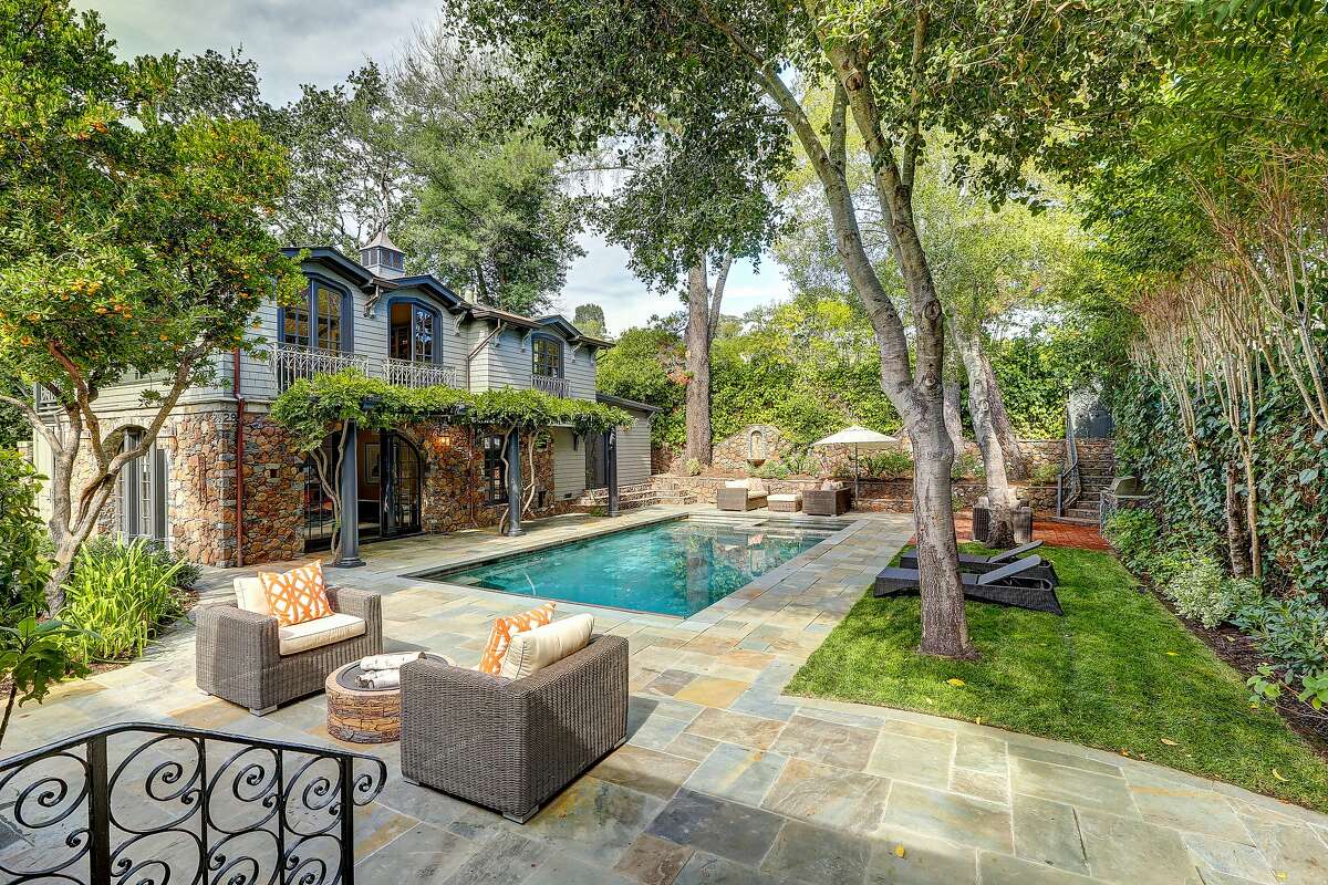 Soothing style, welcoming pool patio defines Dutch Colonial in Ross