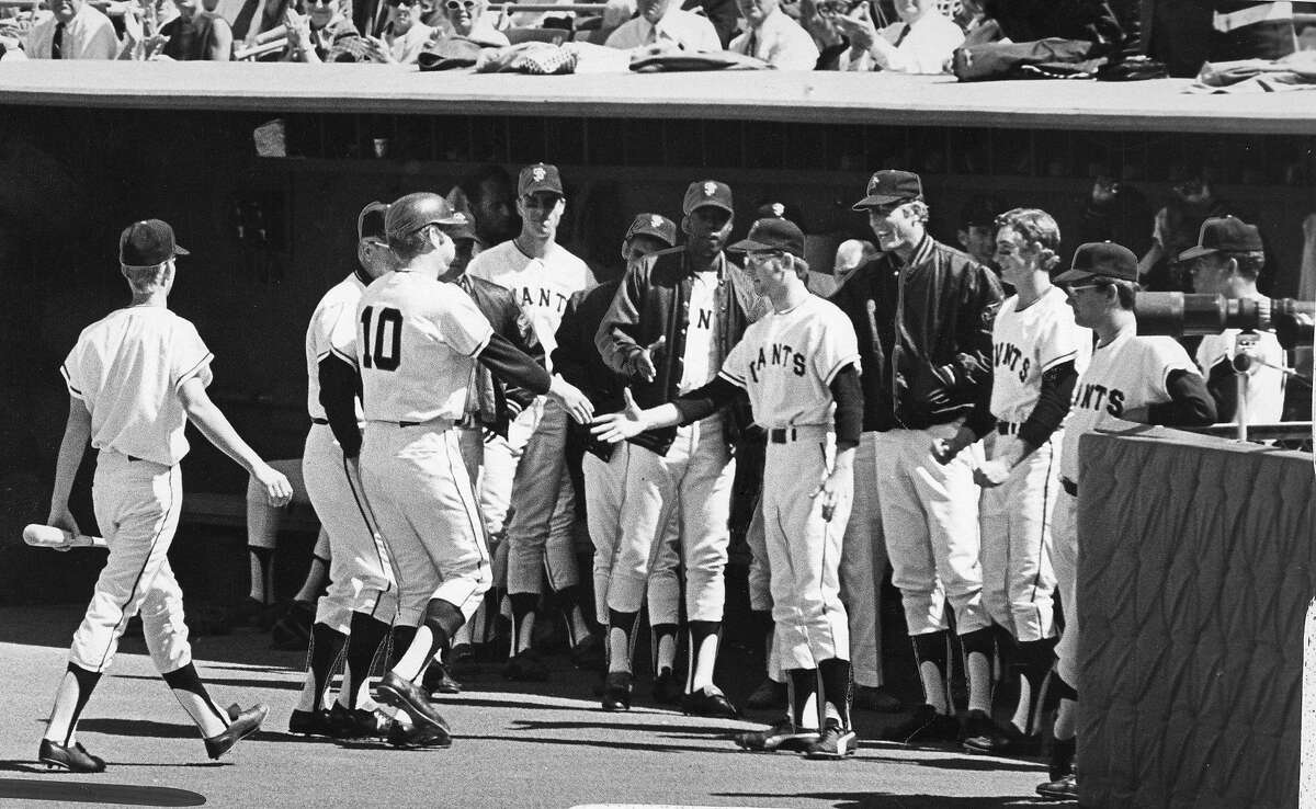 Al Gallagher (#10) was greeted at the dugout after hitting a home run at the 1971 San Francisco Giants opening day, at Candlestick Park, April 12, 1971.