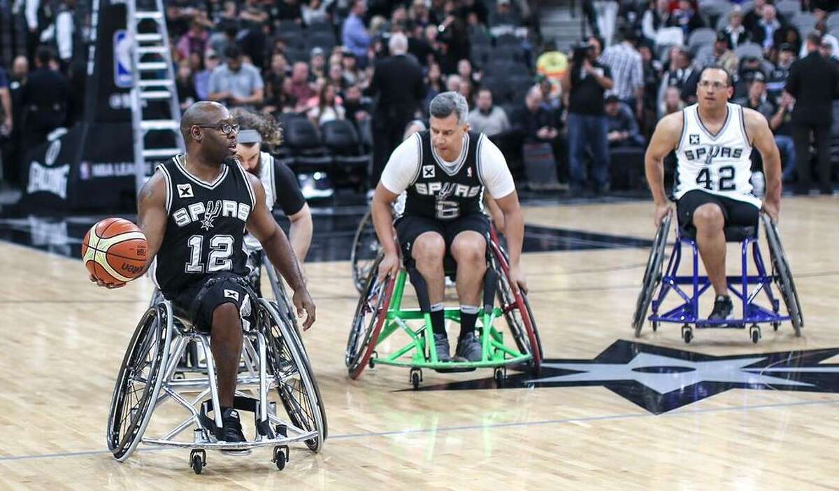 Charles Armstead (12) competes for the Spurs-sponsored wheelchair basketball team during a 2017 game at the AT&T Center.