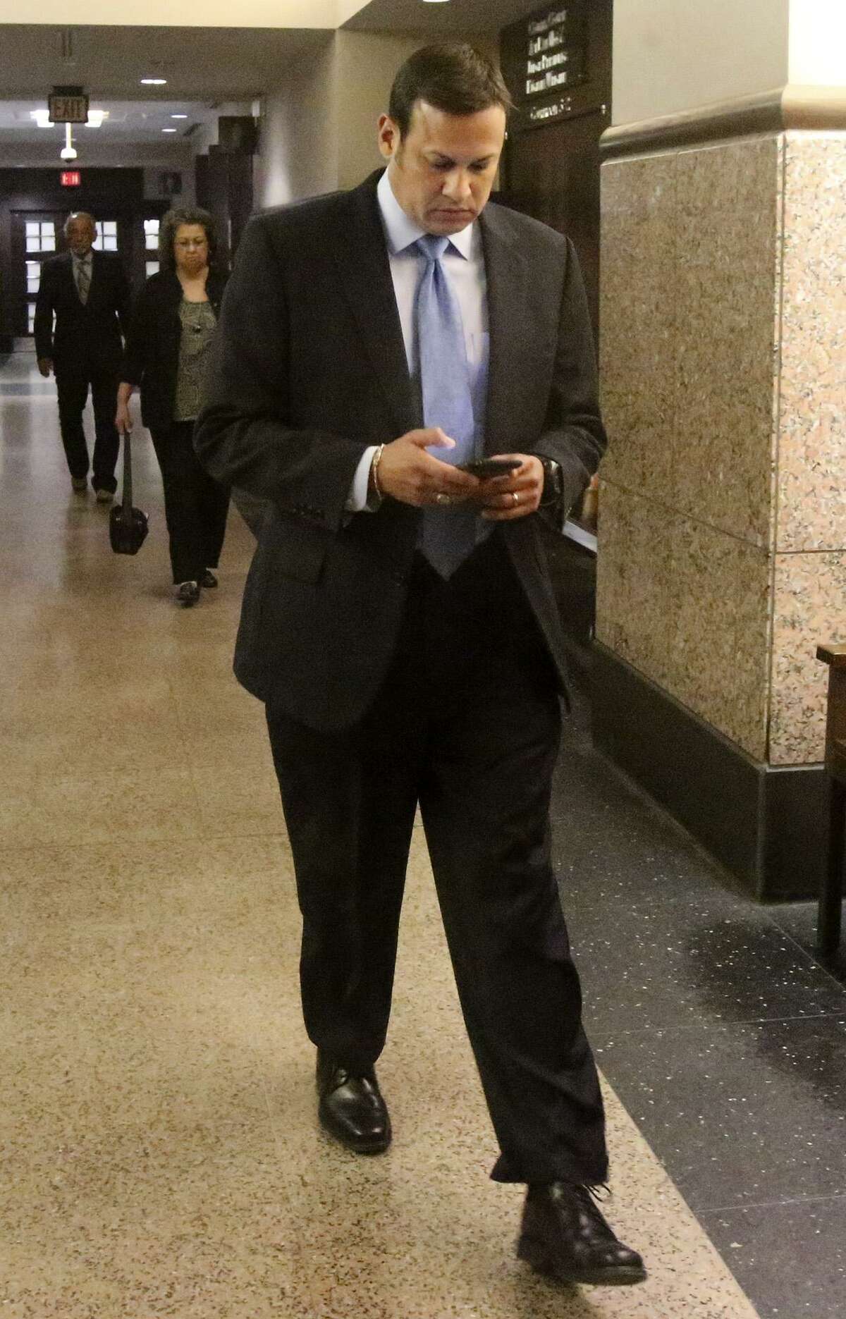 San Antonio attorney Mark Benvides walks to the 186th District Court Thursday March 23, 2017. The San Antonio attorney is accused of coercing clients into having sex with him in exchange for money or legal services and videotaping the encounters.