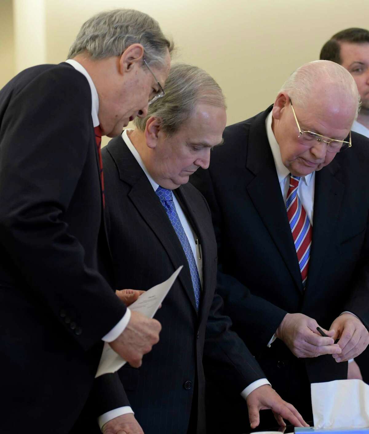 Former Senator George Maziarz, second from left, with his attorneys E. Stewart Jones of Troy, left, and Joe Latona of Buffalo, center, stands before Judge Peter Lynch for his arraignment in Albany County Court on five counts of offering a false instrument for filing in the first degree on Thursday, March 23, 2017, in Albany, N.Y. (Skip Dickstein/Times Union)
