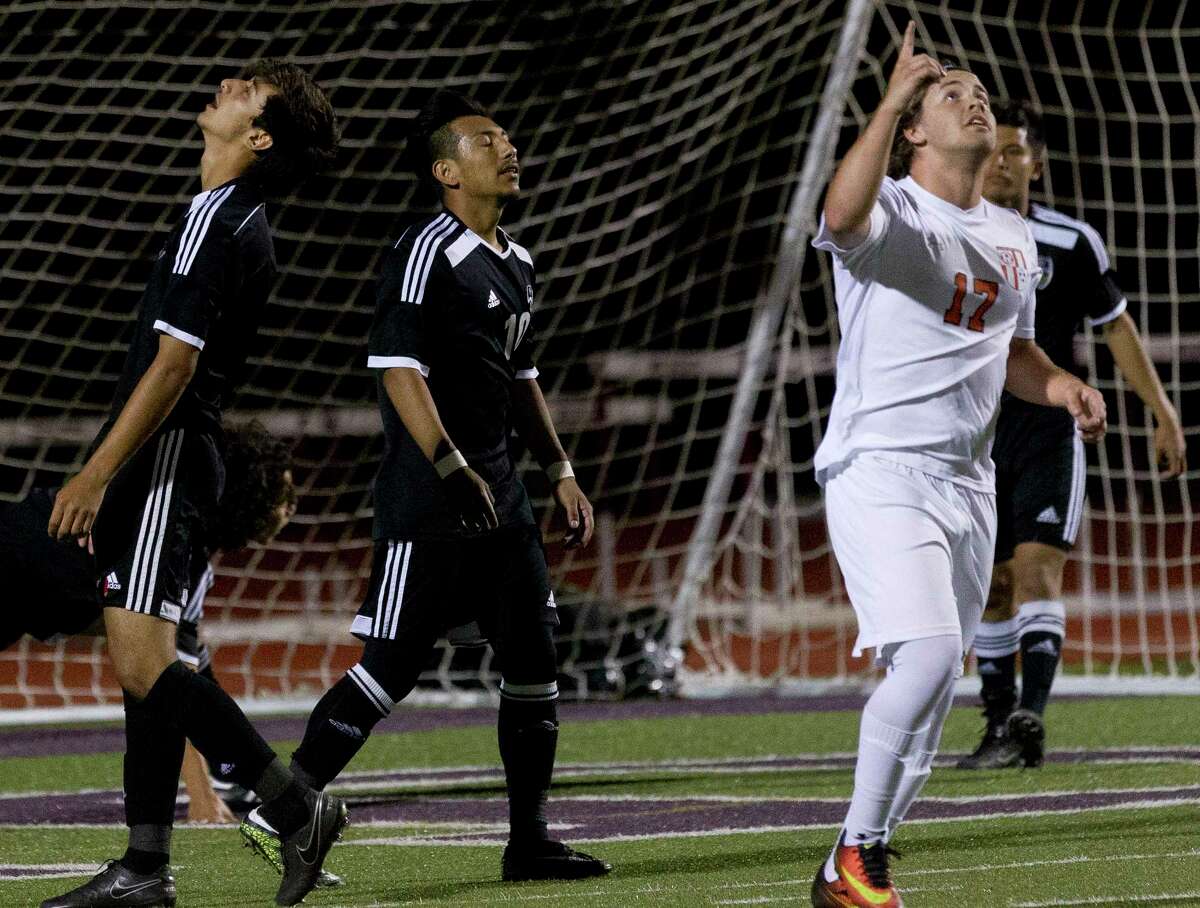 Conroe midfielders Servando Rosales (8) and Alexis Ochoa (10) react to Rockwall midfielder Luke Harbin's game-winning goal during the second period of Region II-6A bi-district high school soccer playoff match at Palestine High School Thursday, March 22, 2017, in Palestine. Rockwall defeated Conroe 2-1.