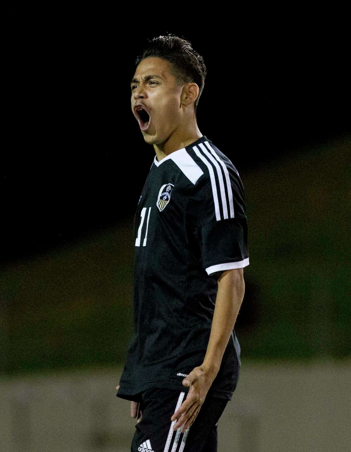 Conroe forward Danny Bonilla (11) motions toward the crowd after scoring a goal during the second period of Region II-6A bi-district high school soccer playoff match at Palestine High School Thursday, March 22, 2017, in Palestine. Rockwall defeated Conroe 2-1.