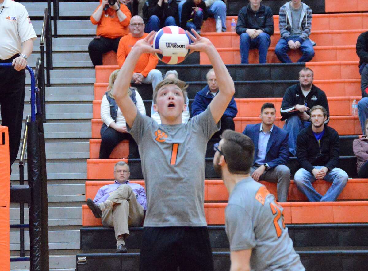 Edwardsville setter Lucas Verdun puts up a pass for a teammate during the first game against Belleville Althoff inside Lucco-Jackson Gymnasium.