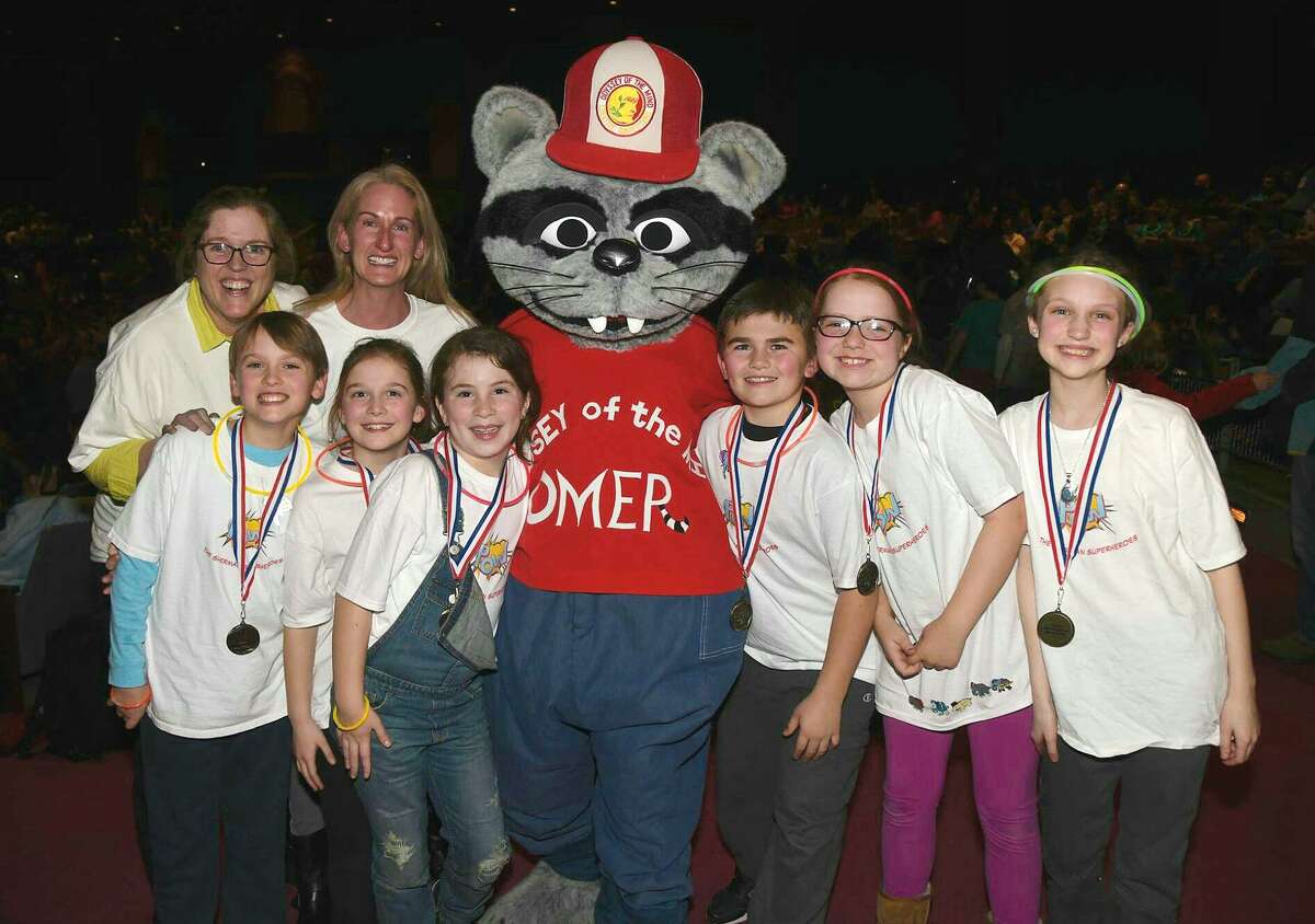 A team from Roger Sherman Elementary School tied for first place at regionals and has qualified for Odyssey of the Mind world finals in Michigan in May. From left: Coaches Suzee Meehan and Susannah Emra and students Jack Emra, Elizabeth Dayton, Addy Dignon, Omer, Andrew Sakey, Libby Meehan and Sabine Brown.