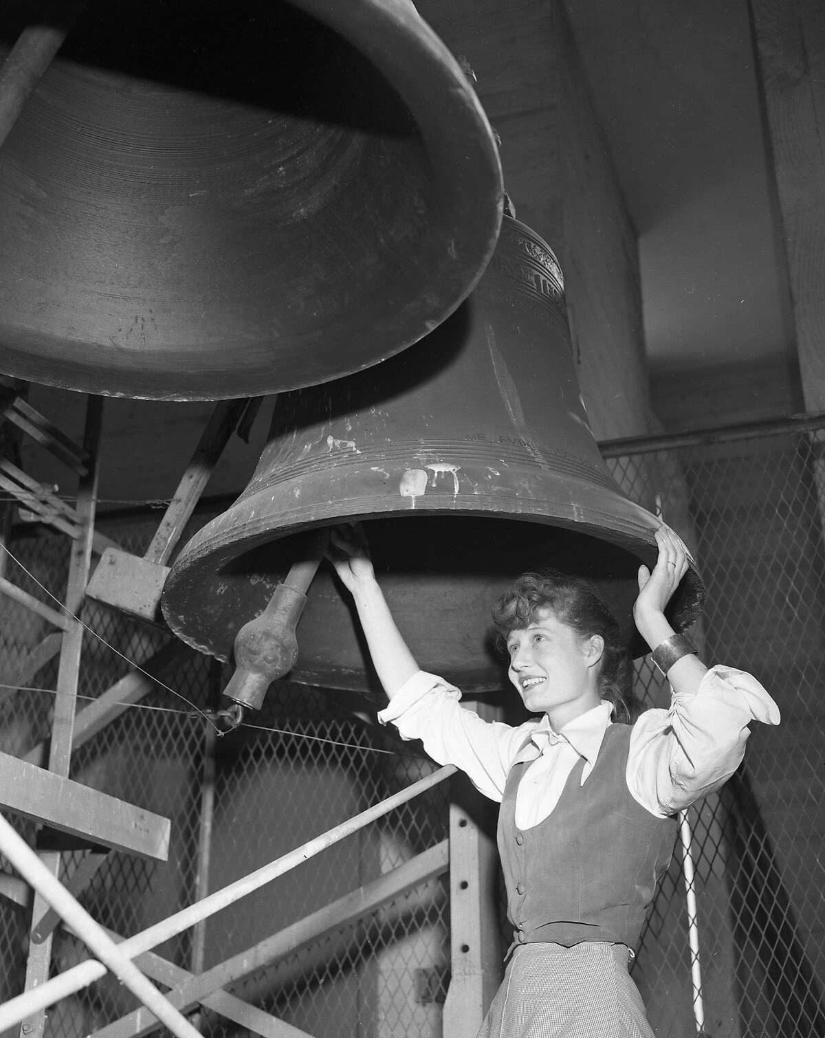 Bells of the Hoover Institution Tower on the Stanford University Carillon player Olwen Wymark looks at bells Photos shot November 3, 1953