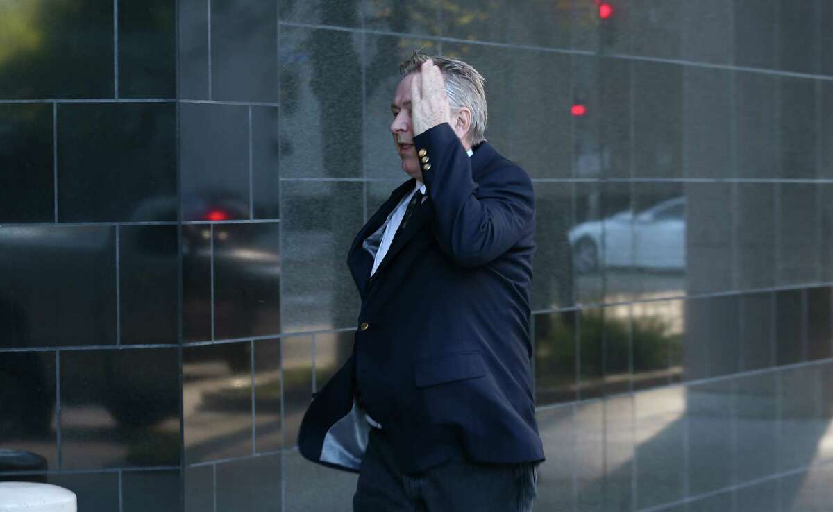 Steve Stockman covers his face while entering the United States District Courthouse Tuesday, March 21, 2017, in Houston. Keep clicking to learn more about Stockman's political career. 