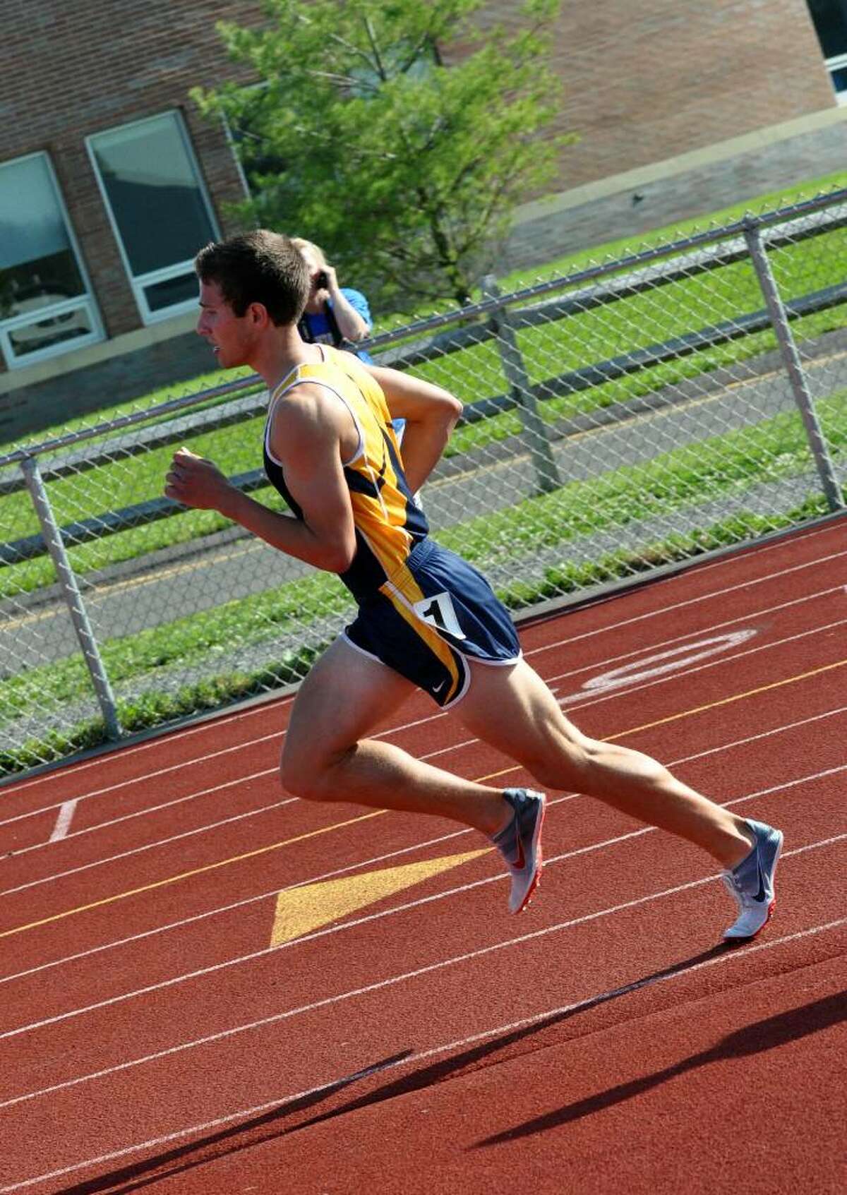 Weston's Steven Piscatelli takes the lead in the 1600 during the SWC boys track championship at Weston on Tuesday, May 25, 2010.