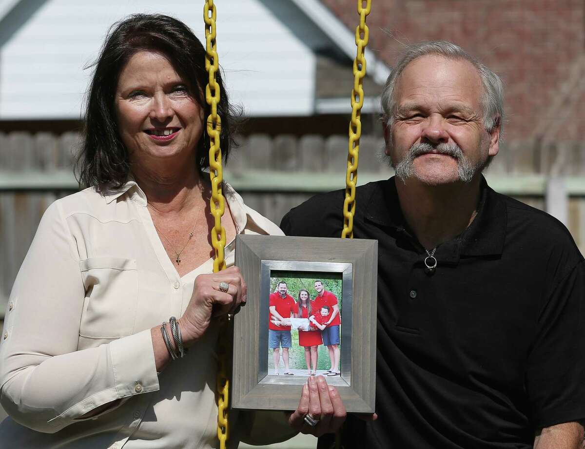 Janis and Matt Stewart hold a frame of the family of her daughter, Sunday Stewart Rowan, on a swing set in their backyard Friday, March 3, 2017, in College Station. Rowan and her husband Matt Rowan, right in the photo, died in the hot air balloon crash in Lockhart in 2016, and left behind a son, Jett Sunday Jones. On the left in the photo is Jett's father, Brent Jones.