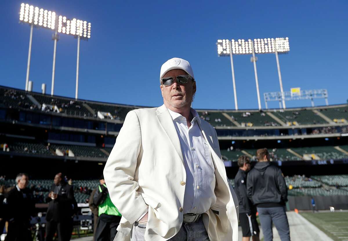 FILE - In this Dec. 24, 2016, file photo, Oakland Raiders owner Mark Davis waits for the team's NFL football game against the Indianapolis Colts in Oakland, Calif. The Raiders' new stadium in Las Vegas could literally be walking distance from a few of the city�s dozens of sports books. The bottom-line explanation for this move speaks as much about priorities in Vegas as in the NFL: It�s about cold, hard cash. The new stadium will be funded by $750 million from the county, another $650 million from either billionaire Sheldon Adelson or another investor and the remaining $500 million from the Raiders and the league. (AP Photo/Marcio Jose Sanchez, File)
