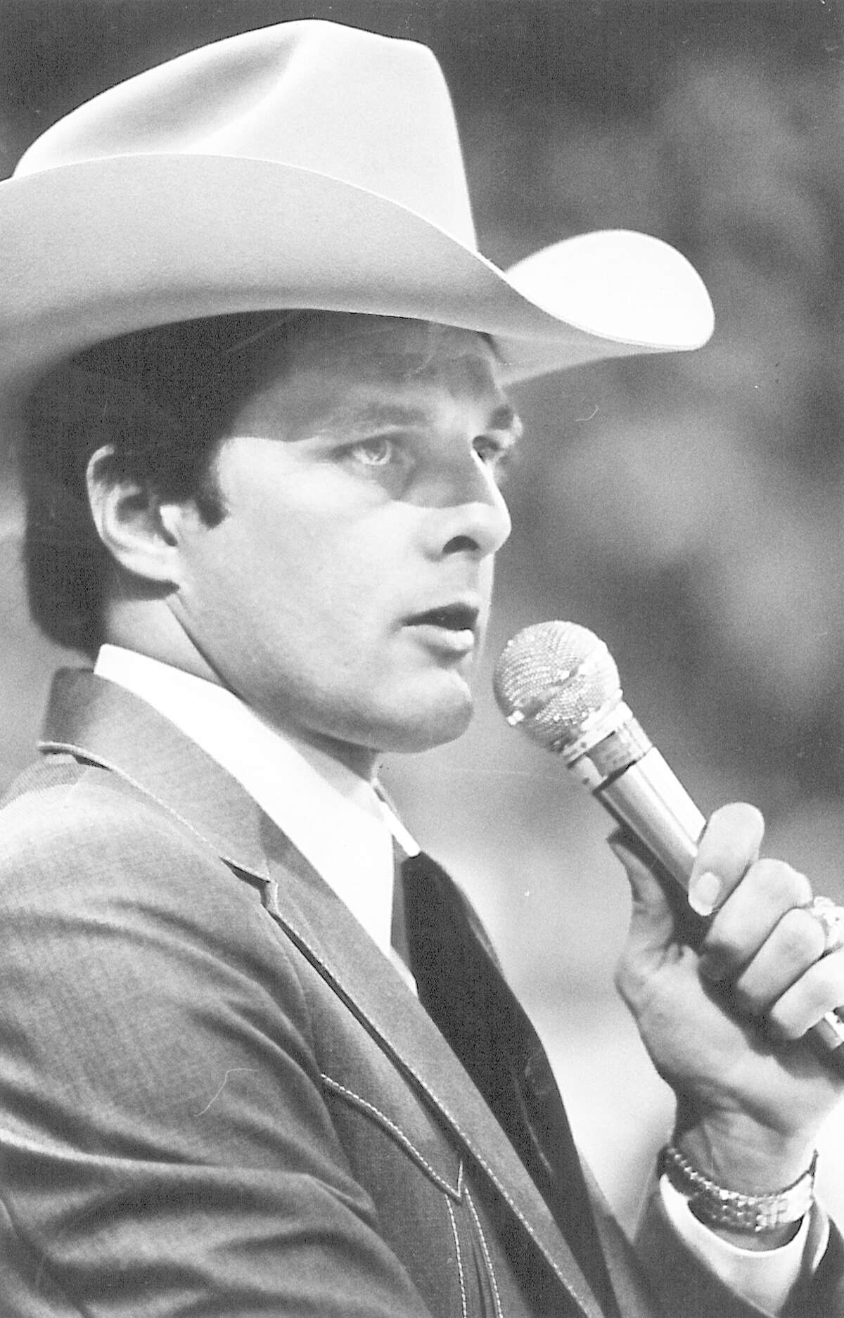 Tod Endsley announces bull riders at the 1993 YMBL rodeo.