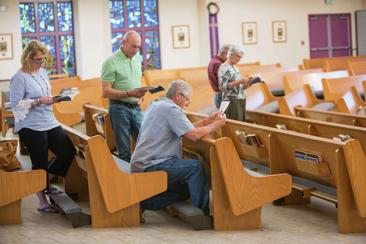 People pray for healing during the Friday night Pentecostal service at the St Ann's Catholic Church in La Vernia, Texas. The community was rocked last week when several students were arrested on sexual assault charges stemming from hazing.