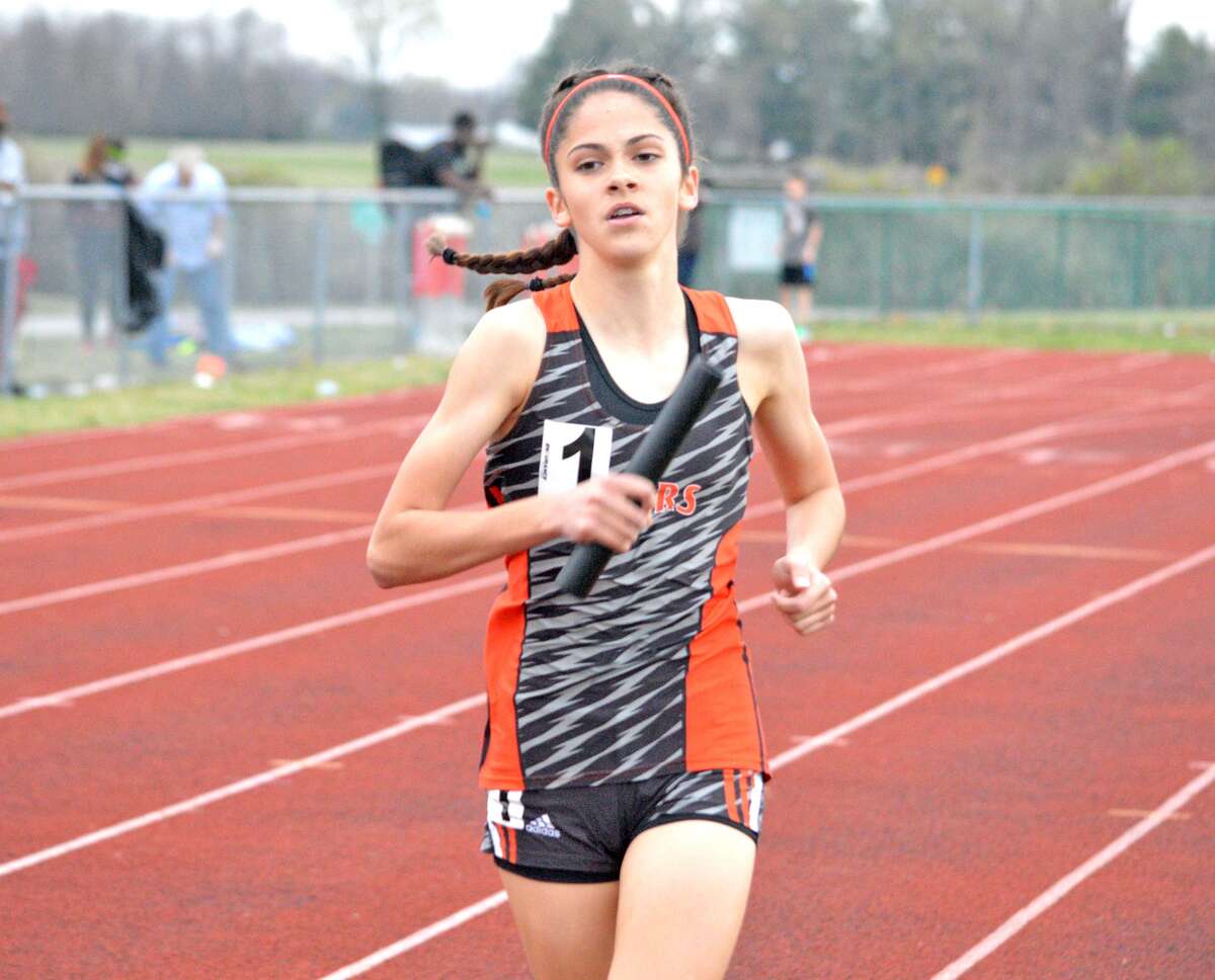 Edwardsville freshman Abby Korak competes in the girls’ distance medley relay on Friday during the Southwestern Illinois Relays at the Winston Brown Track and Field Complex.