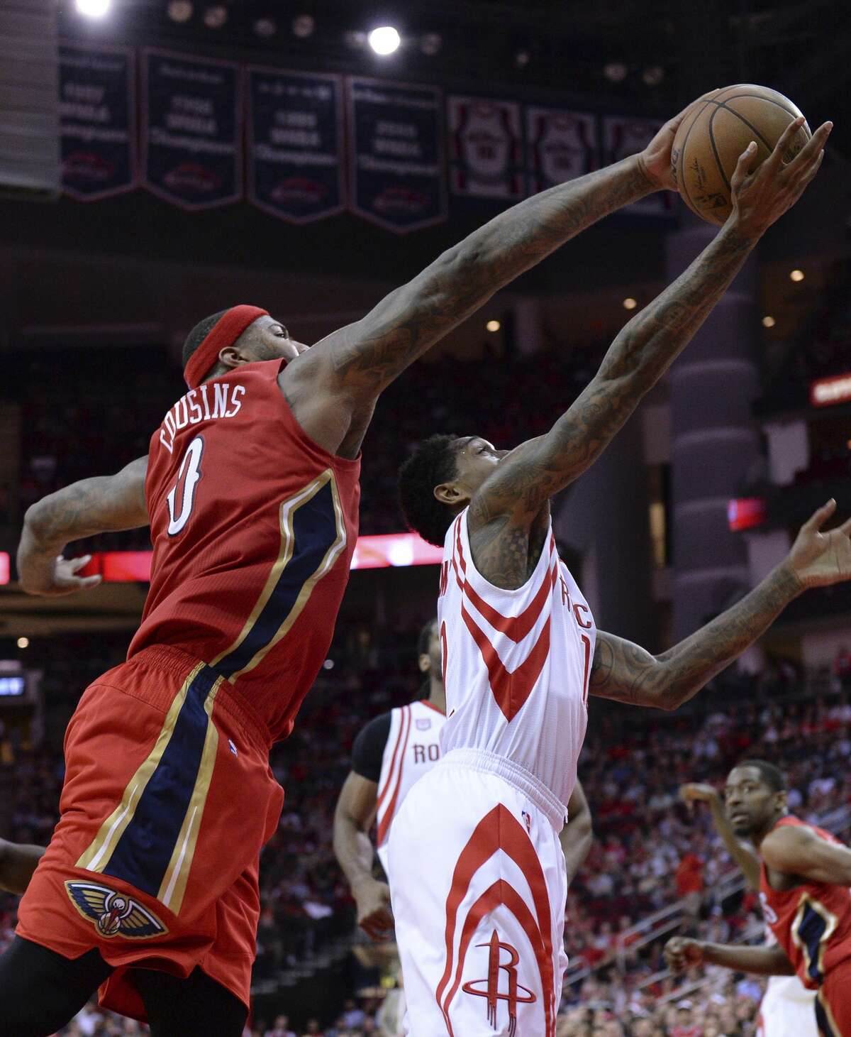 New Orleans Pelicans forward DeMarcus Cousins (0) blocks a shot by Houston Rockets guard Lou Williams, right, in the second half of an NBA basketball game Friday, March 24, 2017, in Houston. (AP Photo/George Bridges)