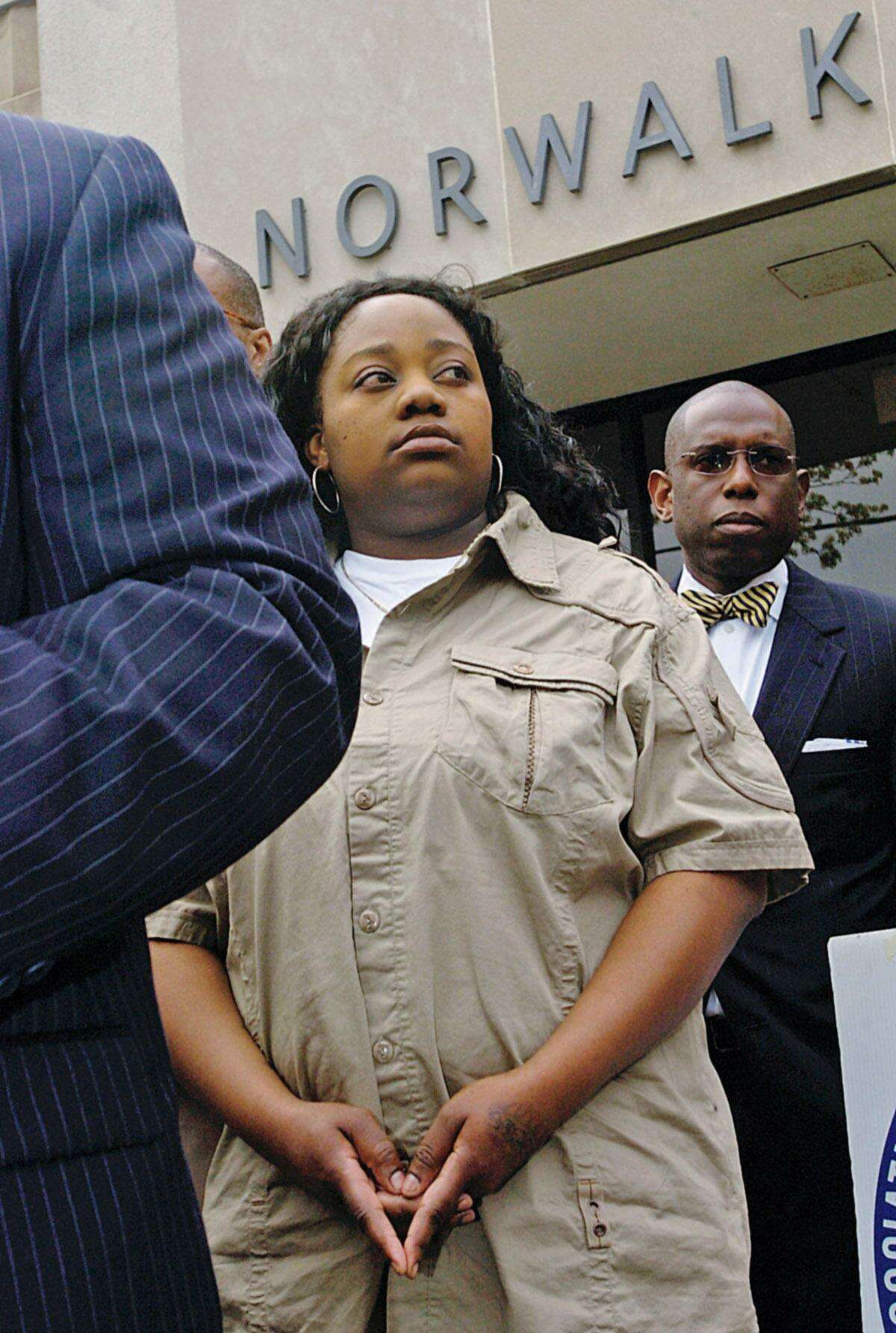 Tanya McDowell, who was arrested and charged with larceny and conspiracy to commit larceny for allegedly stealing $15,686 from Norwalk schools after she enrolled her son in a city elementary school, attends a press conference outside Norwalk Superior Court Wednesday, April 27, 2011 in Norwalk.