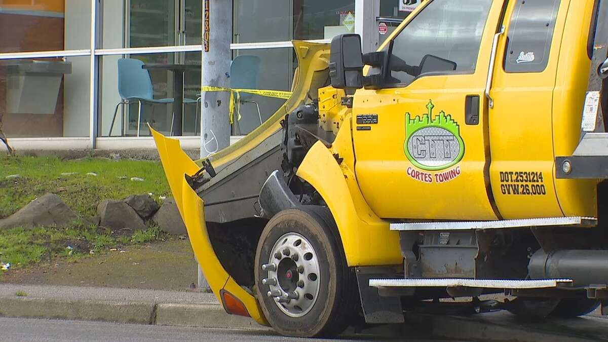 Road closed after car smashes into tow truck in Burien