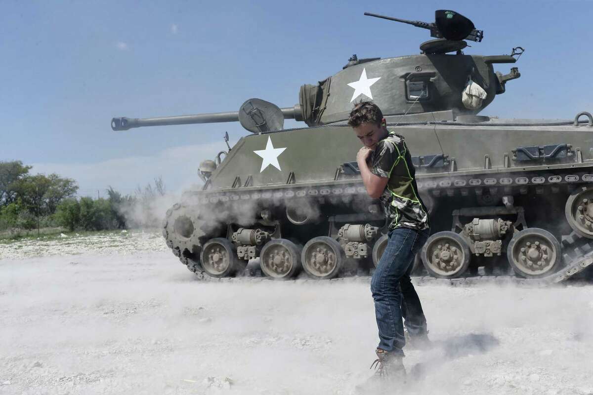 Carson Rogers, 13, shoots a 75mm round from a Sherman tank at Drivetanks.com just north of Uvalde, Texas, Sunday, March 26, 2017. Rogers, of San Antonio, also got to drive the tanks as a birthday present from his father, Darren Rogers.
