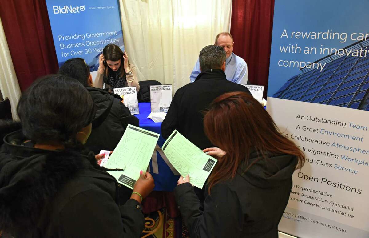 Job seekers stand in line to talk to representatives at the BidNet booth during the Times Union Job Fair at the Albany Marriott hotel on Monday Jan. 16, 2017 in Colonie, N.Y. (Lori Van Buren / Times Union)