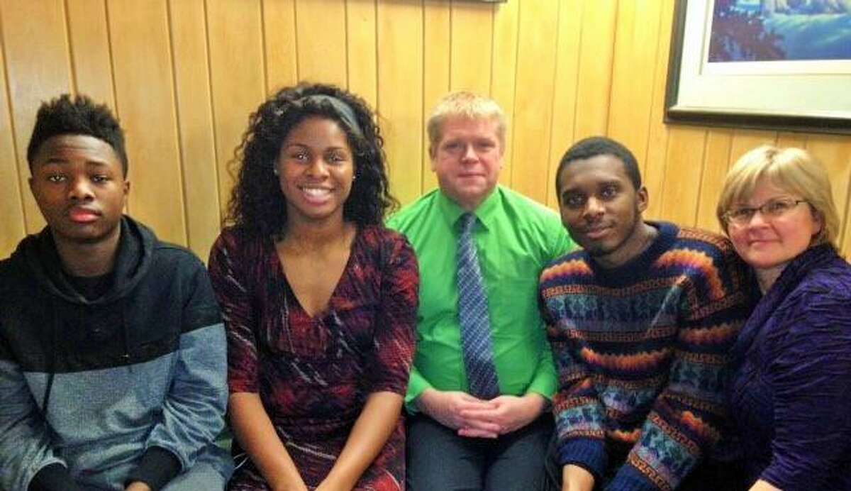 Oregon freshman Ruthy Hebard, second from left, will lead the Ducks against UConn on Monday night in the Bridgeport Regional. From left are Hebard’s brother Isaiah, her father John, her brother Jacob and her mother Dorothy. John and Dorothy Hebard adopted all three of their children.