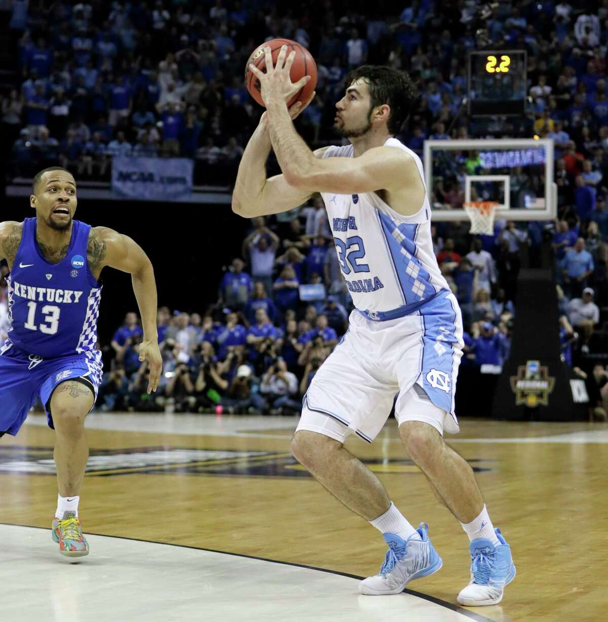 North Carolina forward Luke Maye (32) shoots the winning basket as Kentucky guard Isaiah Briscoe (13) defends in the second half of the South Regional final game in the NCAA college basketball tournament Sunday, March 26, 2017, in Memphis, Tenn. The basket gave North Carolina a 75-73 win. (AP Photo/Mark Humphrey) ORG XMIT: TNMH105