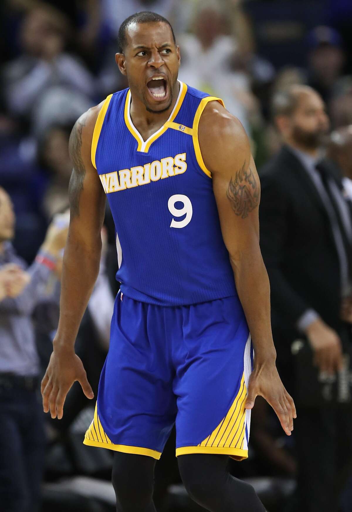 Golden State Warriors' Andre Iguodala celebrates his dunk in 4th quarter during Warriors' 106-94 win over Memphis Grizzlies in NBA game at Oracle Arena in Oakland, Calif., on Sunday, March 26, 2017.