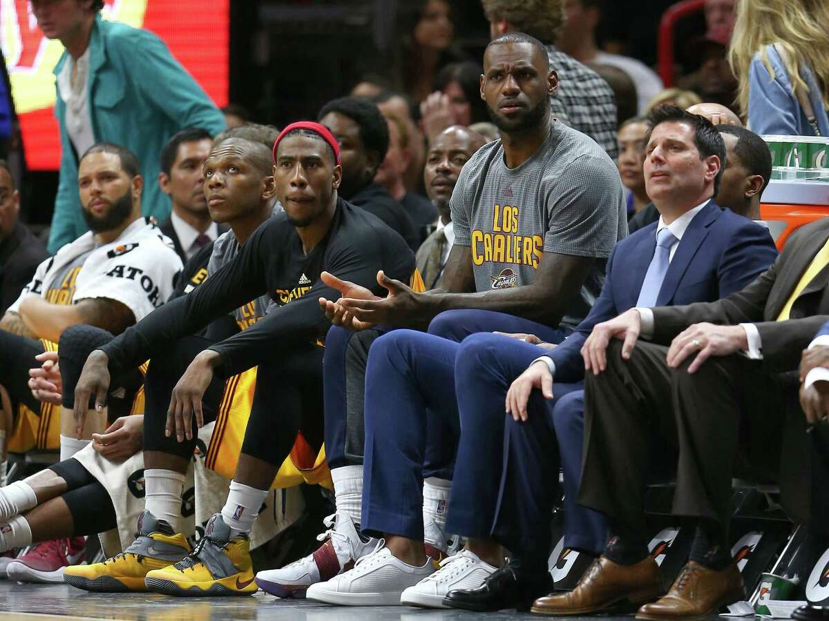 Cleveland Cavaliers star LeBron James watches from the bench during the third quarter against the Heat at American Airlines Arena on March 4, 2017 in Miami.