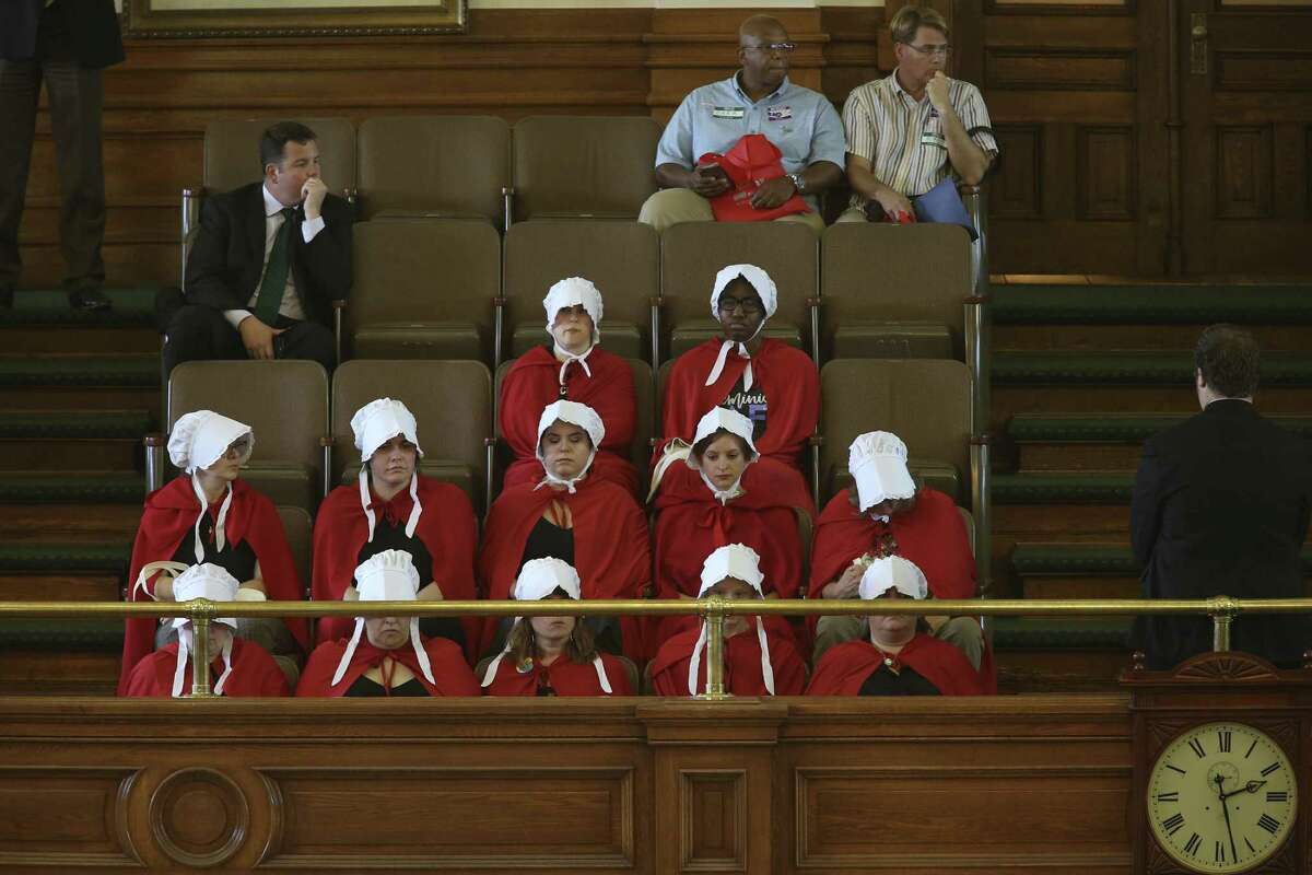 Handmaids show up for the regular session of the Texas Senate, Monday, March 20, 2017. The Senate was considering a couple of anti-abortion bills during Monday?’s session.