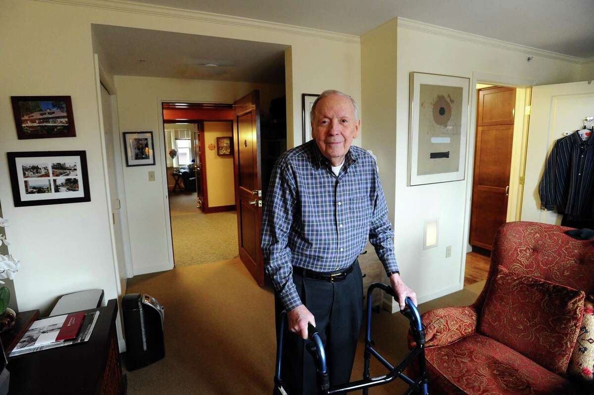 Carrol Houser, 87, poses inside his private room at the Edgehill Retirement Community in Stamford, Conn. on Tuesday, March 21, 2017.
