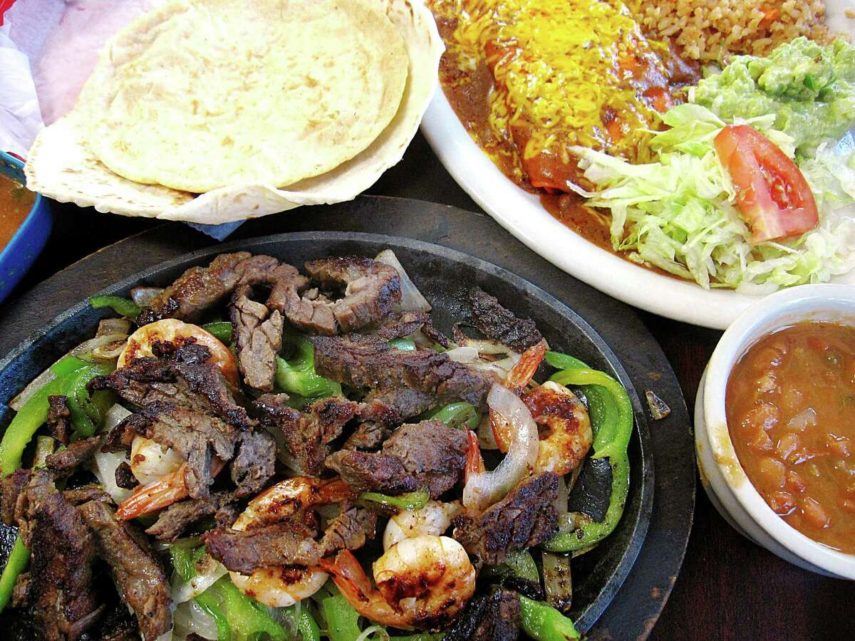 The No. 21 platter at Camila's Mexican Restaurant includes beef fajitas, shrimp, grilled peppers and onions, handmade tortillas, rice, charro beans, guacamole salad and cheese enchiladas.
