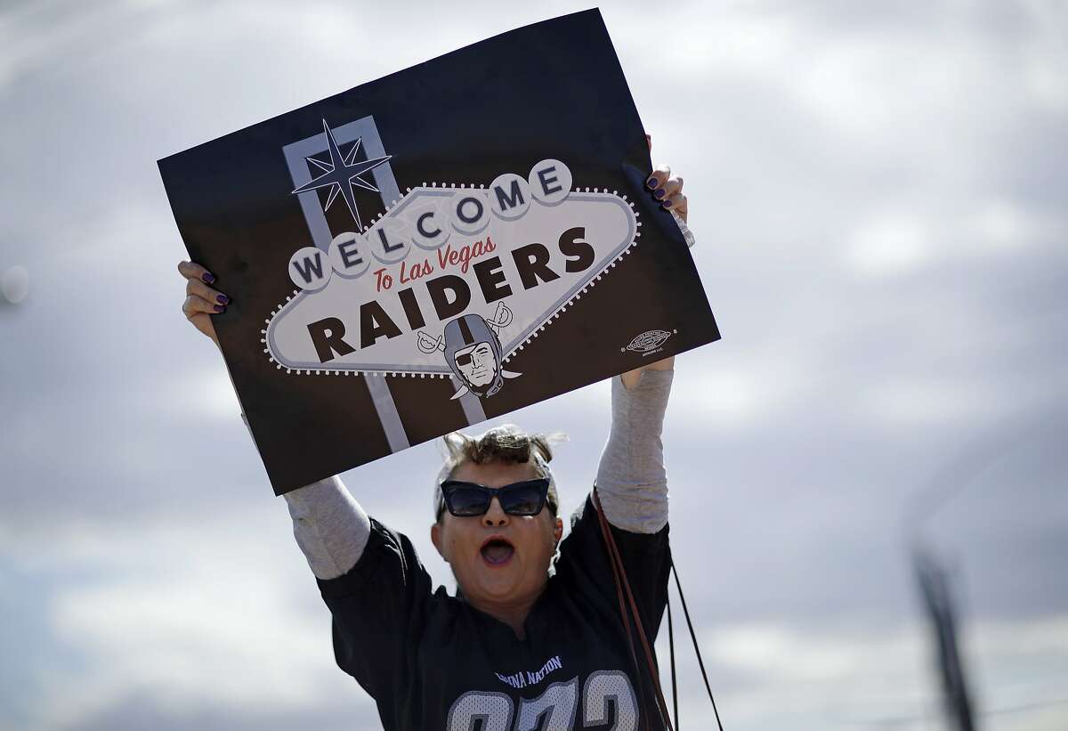 Labor union member Geraldine Lacy celebrates Monday, March 27, 2017, in Las Vegas. NFL team owners approved the move of the Raiders to Las Vegas in a vote at an NFL football annual meeting in Phoenix. (AP Photo/John Locher)