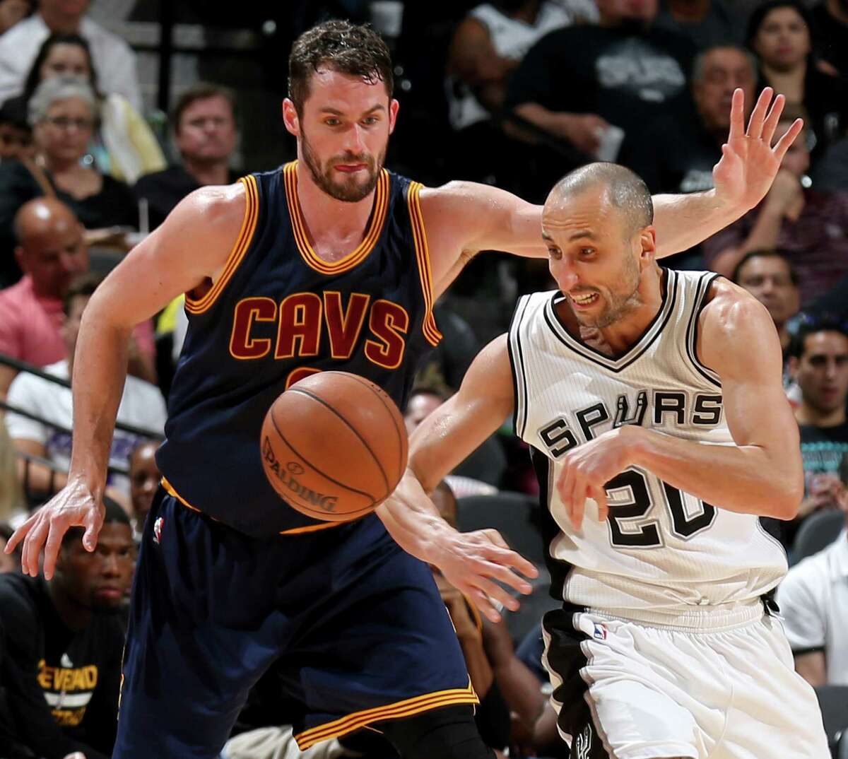 Cleveland Cavaliers' Kevin Love and San Antonio Spurs' Manu Ginobili chase after a loose ball during second half action Monday March 27, 2017 at the AT&T Center. The Spurs won 103-74.