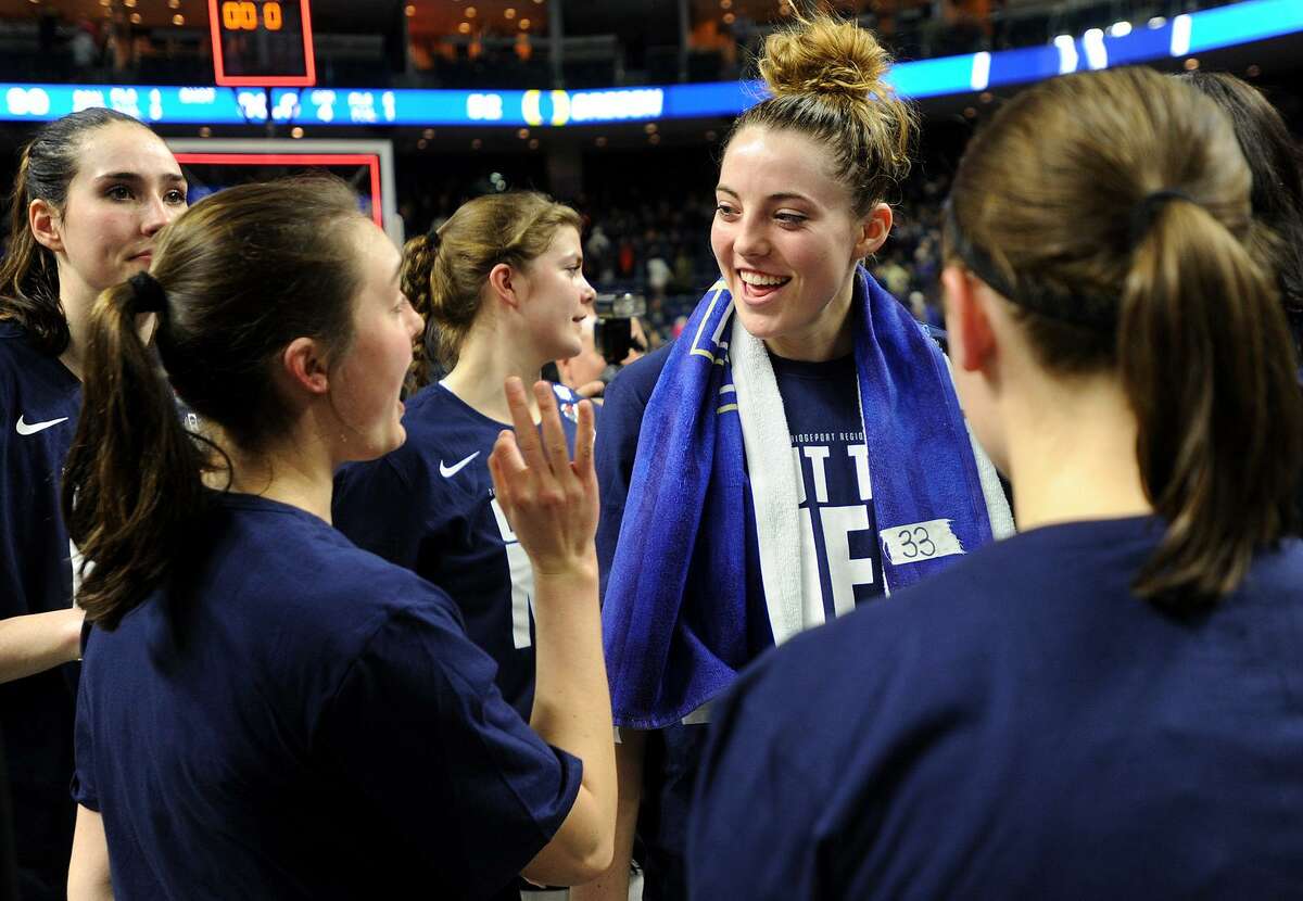 UConn's Katie Lou Samuelson, center, is all smiles following her team's victory over Oregon in the NCAA Women's Basketball Regional Final game at the Webster Bank Arena in Bridgeport, Conn. on Monday, March 27, 2017.