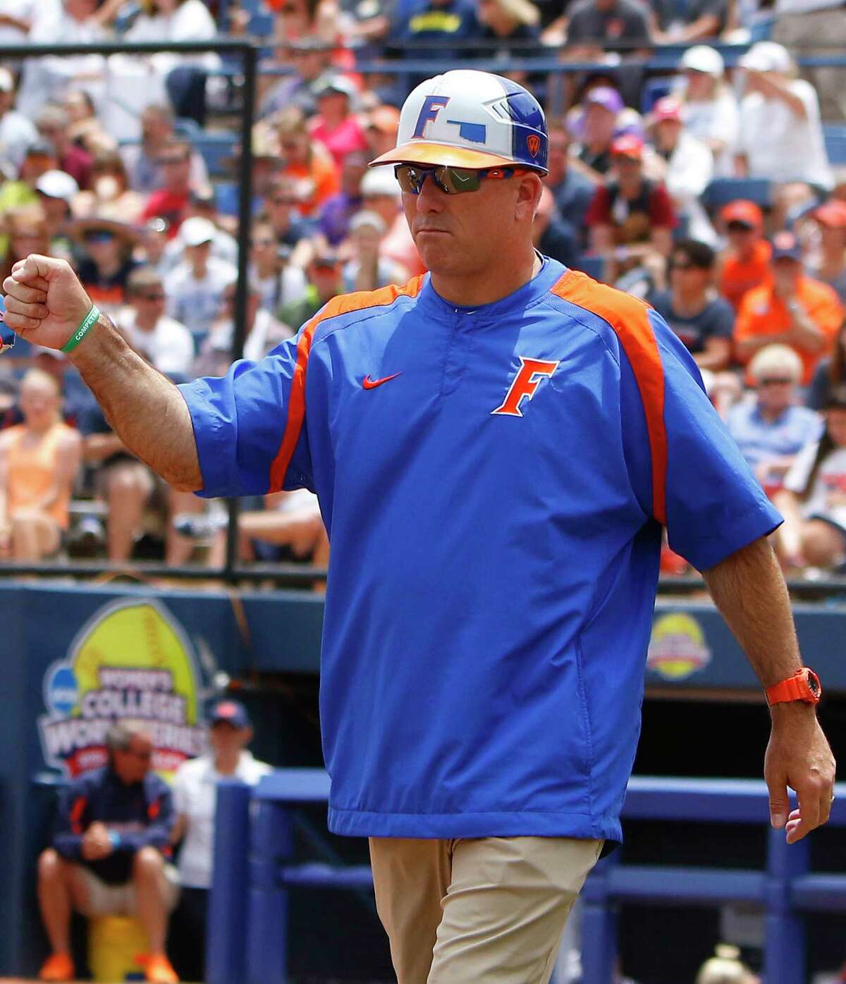 FILE - In this May 31, 2015, file photo, Florida's head coach Tim Walton gestures to one of his players in the fourth inning during an NCAA Women's College World Series game against Auburn in Oklahoma City. Florida softball coach Tim Walton was involved in an altercation with Auburn shortstop Haley Fagan on Monday night, March 27, 2017, after Walton gave Fagan a slight push during postgame handshakes. (AP Photo/Alonzo Adams, FIle)