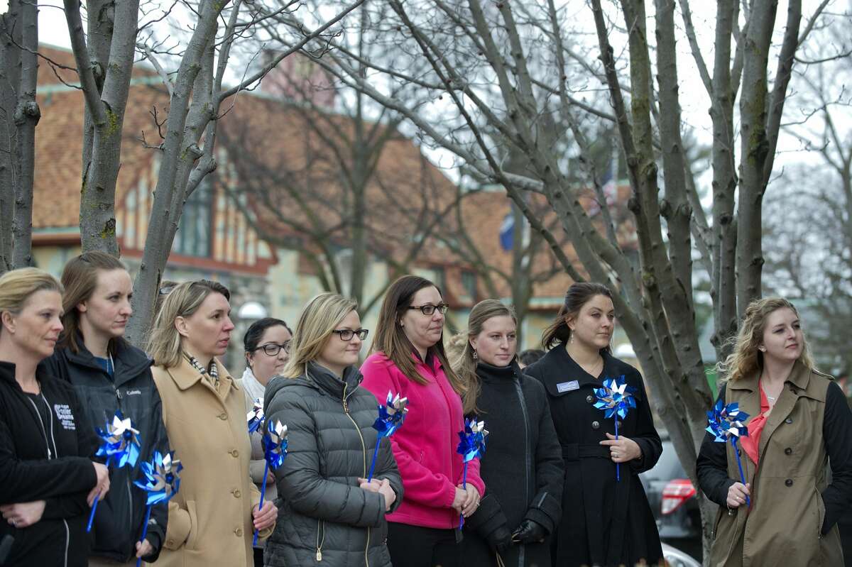 BRITTNEY LOHMILLER | blohmiller@mdn.net Members of the community watch listen to Sheriff Scott Stephenson in front of the United Way of Midland County Tuesday afternoon before planting pinwheels in honor of Child Abuse Prevention Month. In 2016, the Safe & Sound Child Advocacy Center conducted interviews of 140 children who were suspected of being abused or neglected.