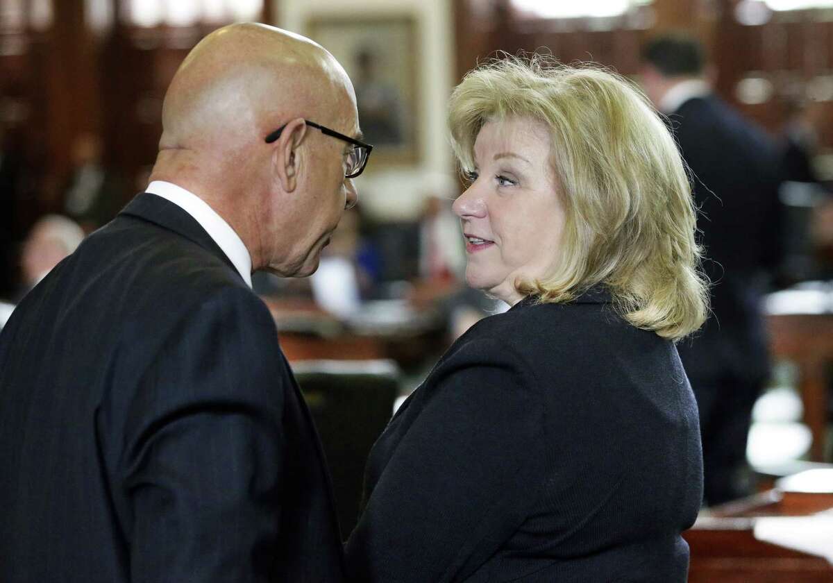 Sen. Jane Nelson, R-Flower Mound, talks with Sen. John Whitmire, D- Houston, on the floor of the Texas Senate in March. Nelson, chairwoman of the Senate Finance Committee, indicated the Legislature may be willing to tap into the state’s rainy day fund to help pay for flood recovery costs — “It’s raining,” she said.