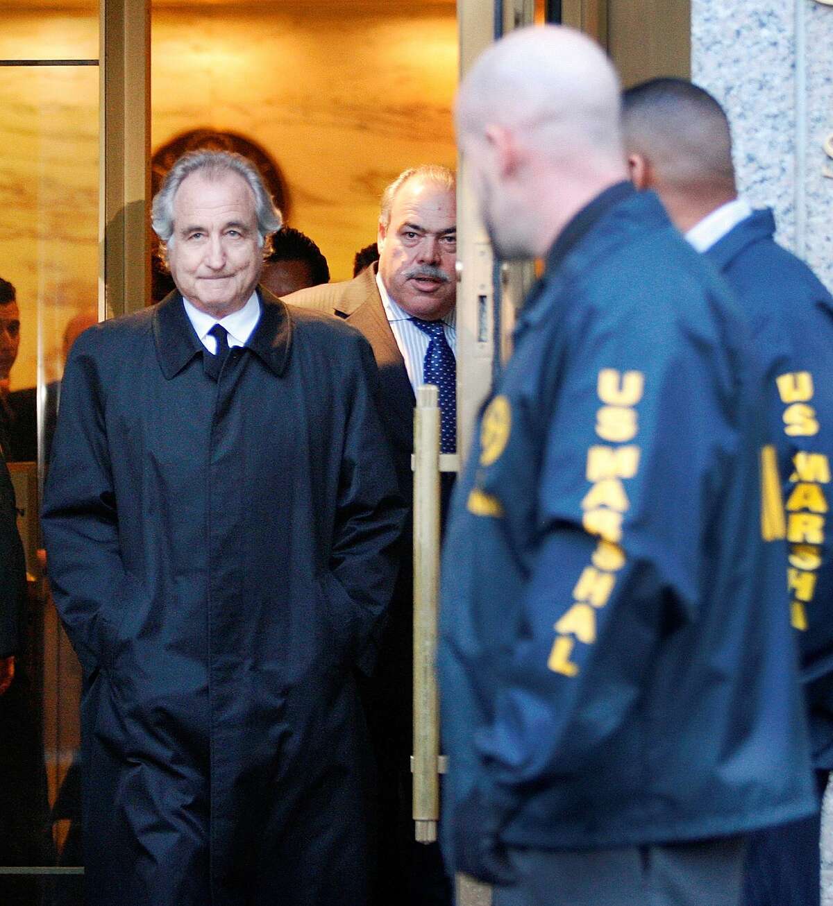 Disgraced financier Bernard Madoff leaves U.S. District Court in Manhattan after a bail hearing in New York, Monday, Jan. 5, 2009. A hedge fund manager linked to Madoff’s crimes died Monday in an apparent suicide.