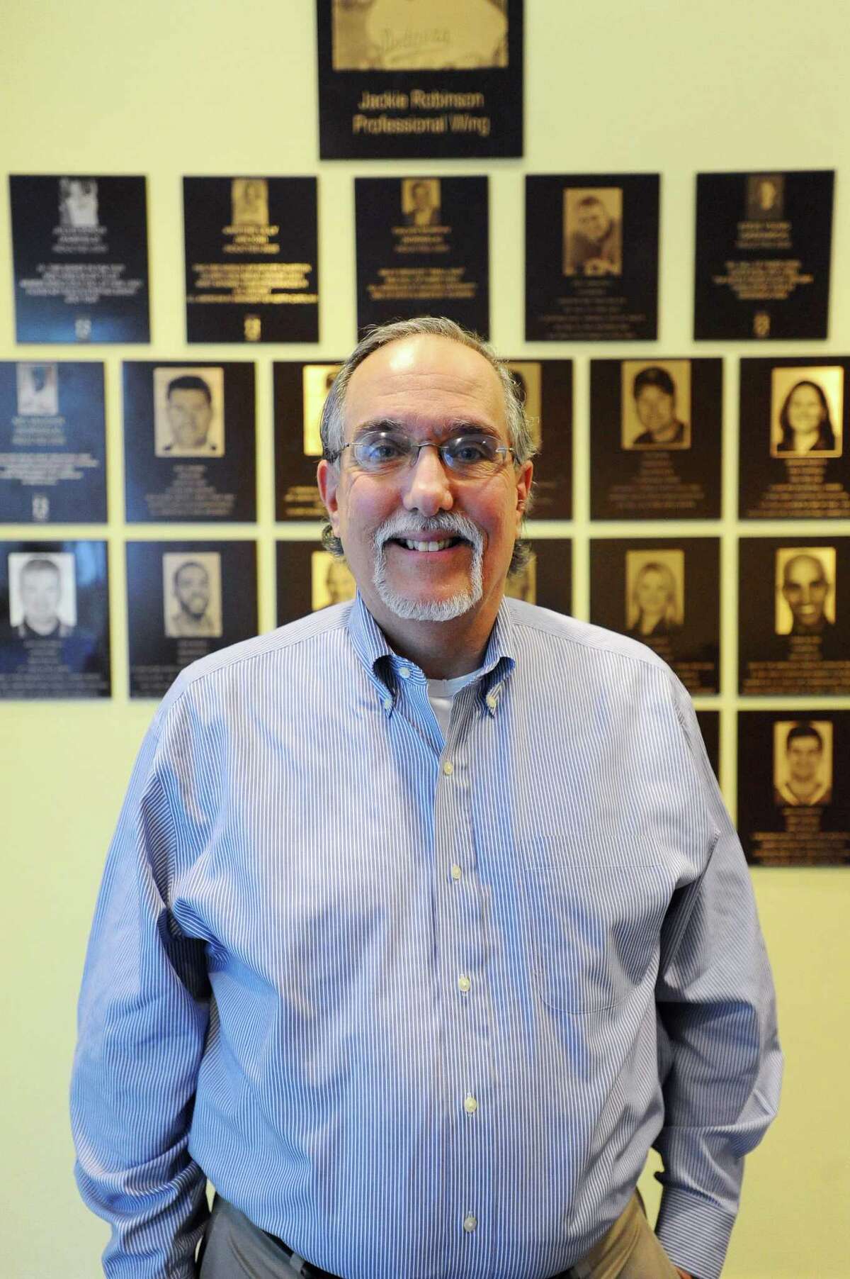 Tom Chiappetta, executive director of the Fairfield County Sports Commission, poses for a photo in front of the Fairfield County Sports Hall of Fame inside UConn Stamford in Stamford, Conn. on Tuesday, March 28, 2017.
