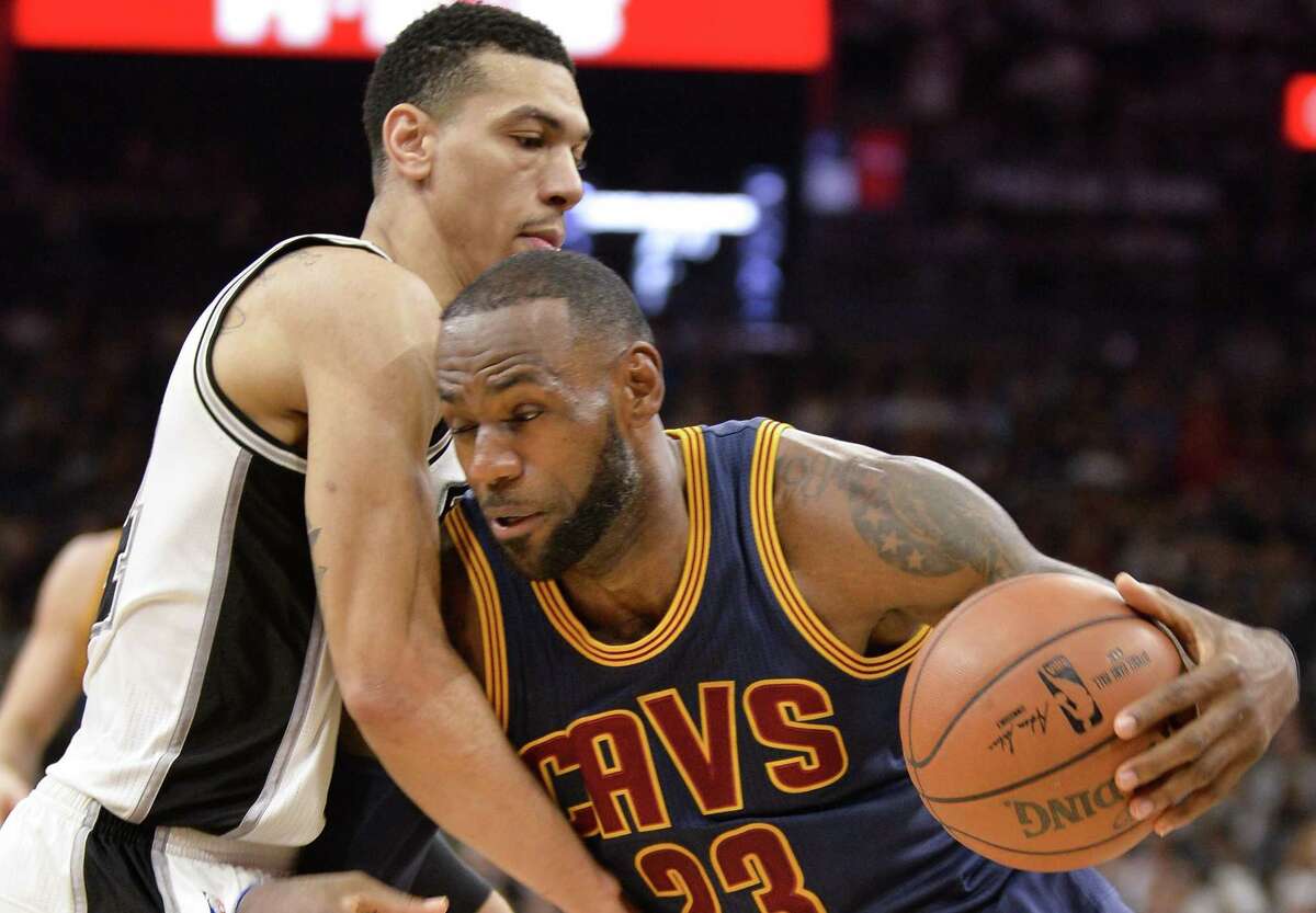 Cleveland Cavaliers forward LeBron James (23) drives against Spurs guard Danny Green during the first half on March 27, 2017, in San Antonio.